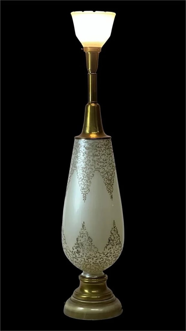 Vintage Torchiere Lamp with Ornate Gold Detailing: Elegant vintage torchiere lamp standing 42 inches tall, featuring a striking gold and cream base with intricate scrollwork details. The lamp is crowned with a frosted glass shade that diffuses light b