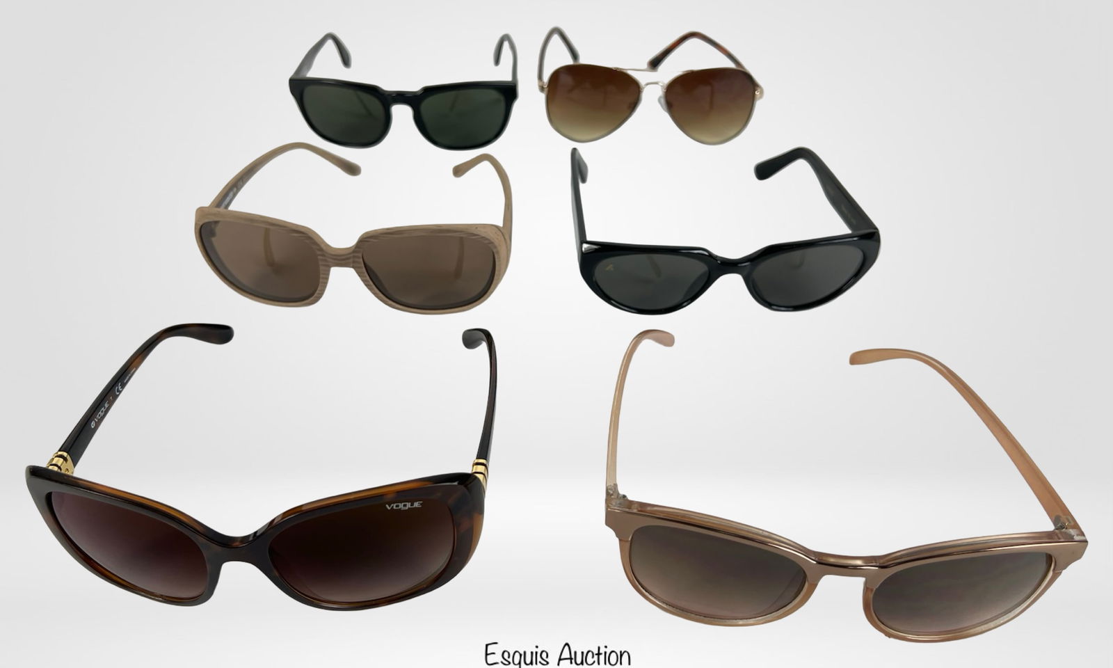 Group of Designer Sunglasses: Collection of six stylish designer sunglasses, featuring a variety of frame shapes, colors, and lens tints. Brands include Vogue, Byblos, Bausch & Lomb, and models such as Tatiana FWG and Lyra.15. Des