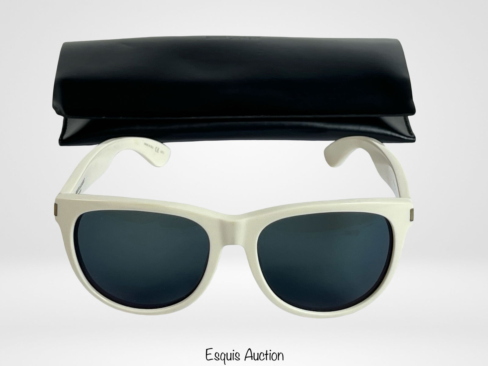 Saint Laurent SL101 Surf Women's Sunglasses: Chic and modern Saint Laurent SL101 Surf sunglasses featuring glossy white acetate frames paired with dark lenses. The bold, timeless silhouette is complemented by the Saint Laurent Paris logo at the