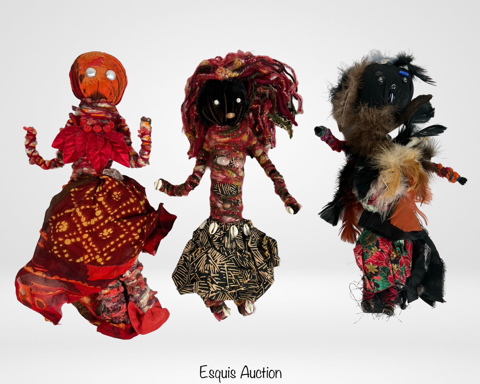 Spirit Voodoo Handcrafted Doll Collection: Set of three handcrafted Spirit Voodoo dolls, each uniquely adorned with vibrant fabrics, textured yarn, and embellishments such as shells, beads, and feathers. Measuring approximately 14" to 16" tall