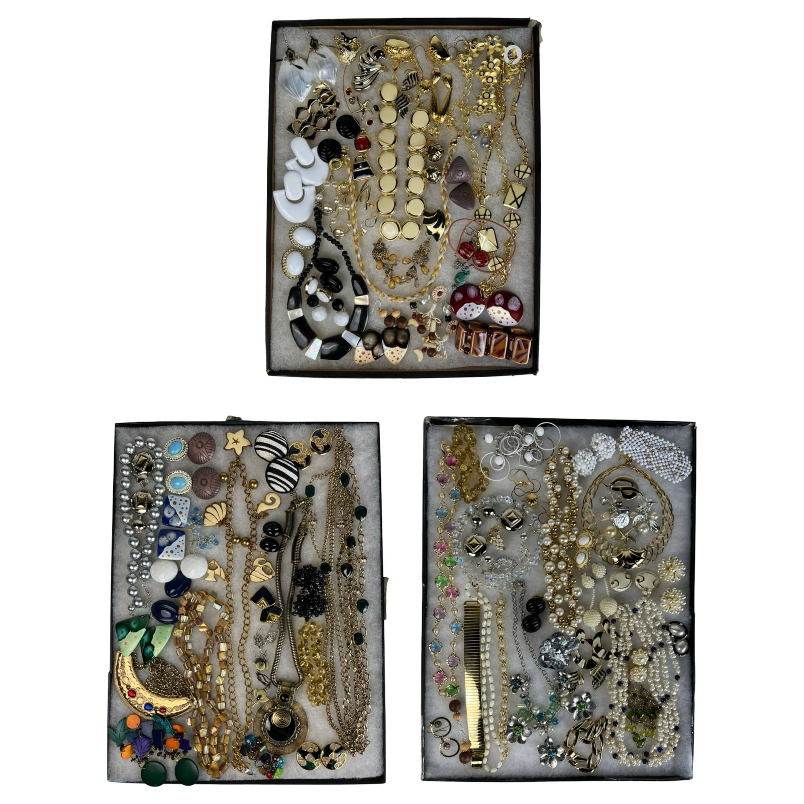 Assortment of Costume Jewelry - Sparkling Variety: Elevate your style with this dazzling Assortment of Costume Jewelry. Bursting with variety, this collection features an array of necklaces, earrings, bracelets, and more, each piece designed to add a 