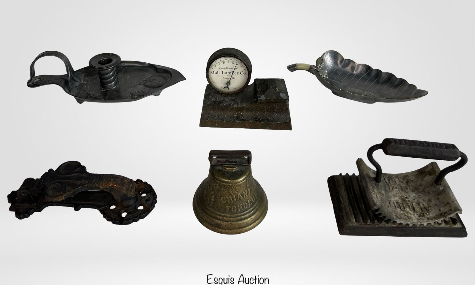 Antique & Vintage Metalwork Decor & Collectibles: This eclectic collection showcases finely crafted utilitarian and decorative objects from the 19th and early 20th centuries. The antique cast iron door knocker presents ornate scrollwork with aged pat