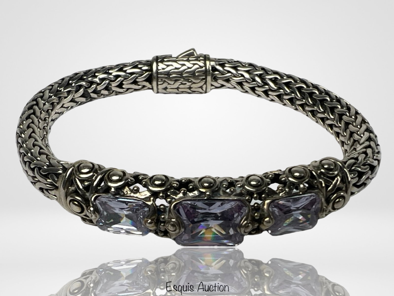 Sterling Silver Balinese Style Bracelet- Cubic Zi: Striking sterling silver statement bracelet in an intricate Balinese woven design, highlighted with ornate beadwork and three large, faceted cubic zirconia stones at the center. The detailed craftsman