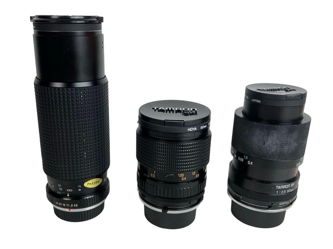 Tamron & Tokina Camera Lenses - Tele-Macro, CF Mac: This lot includes three vintage Japanese camera lenses: a Tamron SP 90mm f/2.5 Tele-Macro lens (Adaptall-2 mount), a Tamron 28-70mm f/3.5-4.5 CF Macro BBAR MC lens with a Hoya 62mm filter, and a Tokin