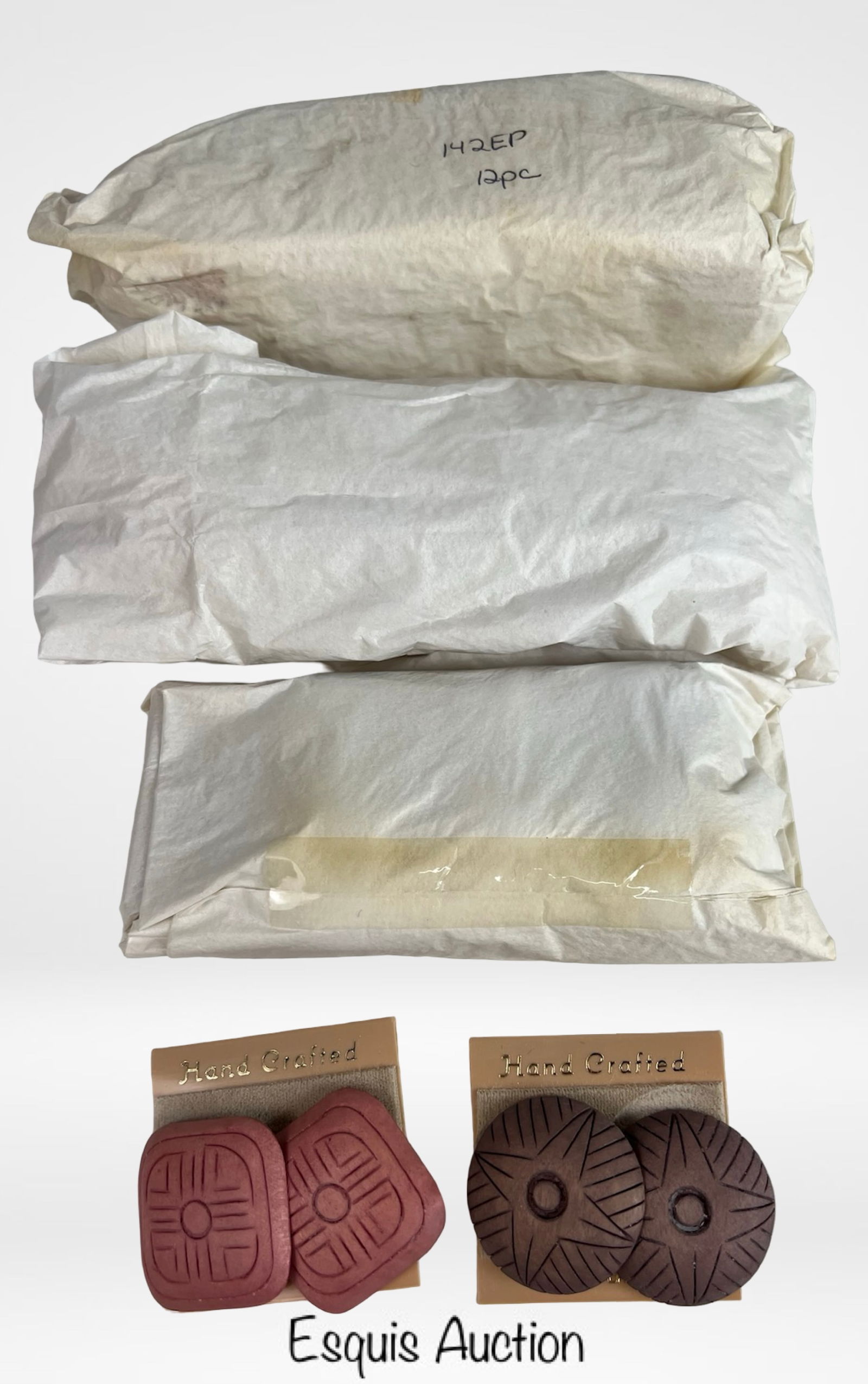 2 Dozen New Old Stock Handcrafted Wooden Earrings: Lot of twenty-four (24) pairs of vintage new old stock handcrafted wooden earrings. Each pair features bold geometric carvings in circular and square forms, with natural earthy tones highlighting thei