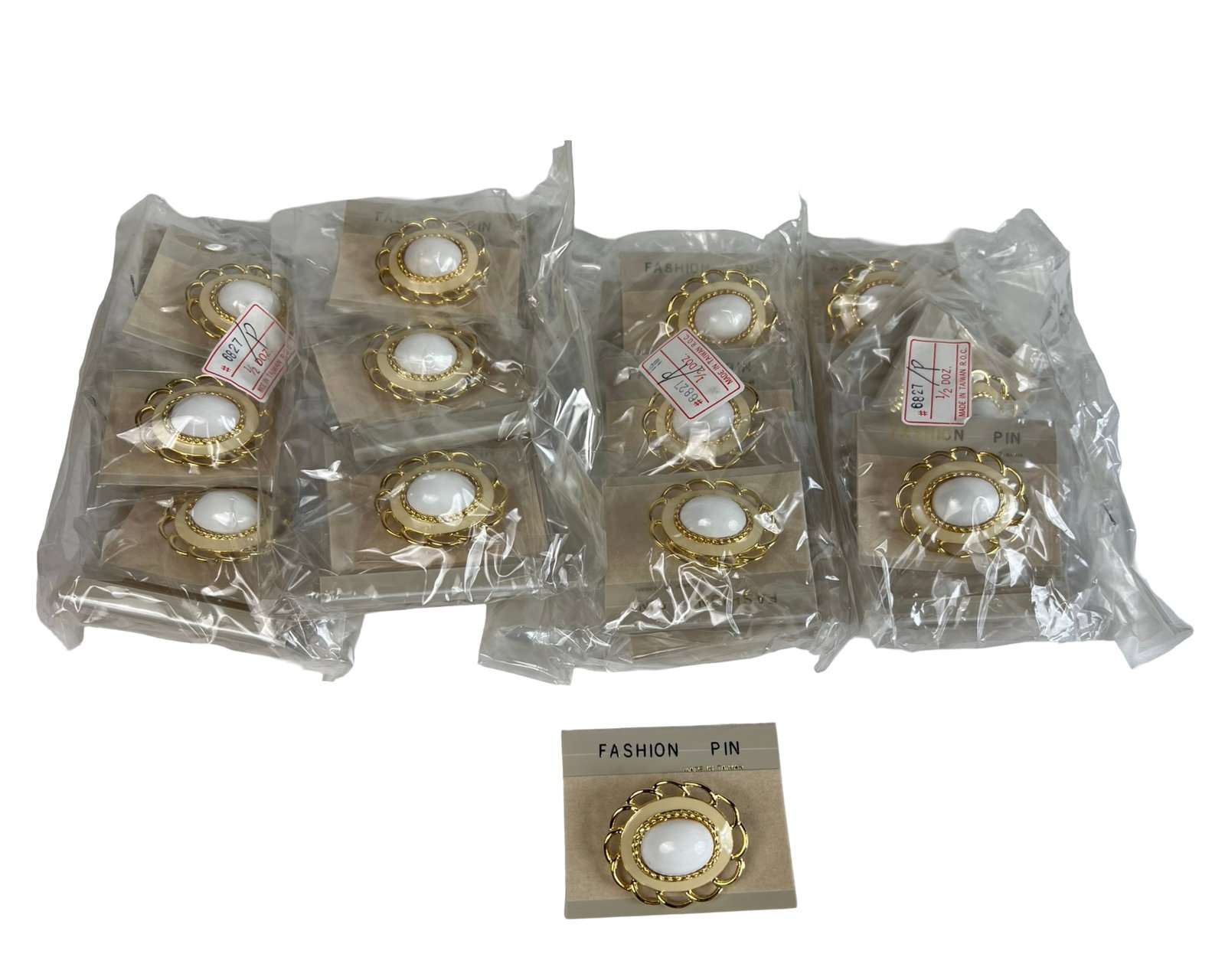 24 New Old Stock Gold-Tone Fashion Pins: Collection of two dozen (24) vintage fashion pins, each designed with a gold-tone scalloped frame and a white cabochon-style center. These elegant pieces offer a timeless accent for blouses, scarves, 
