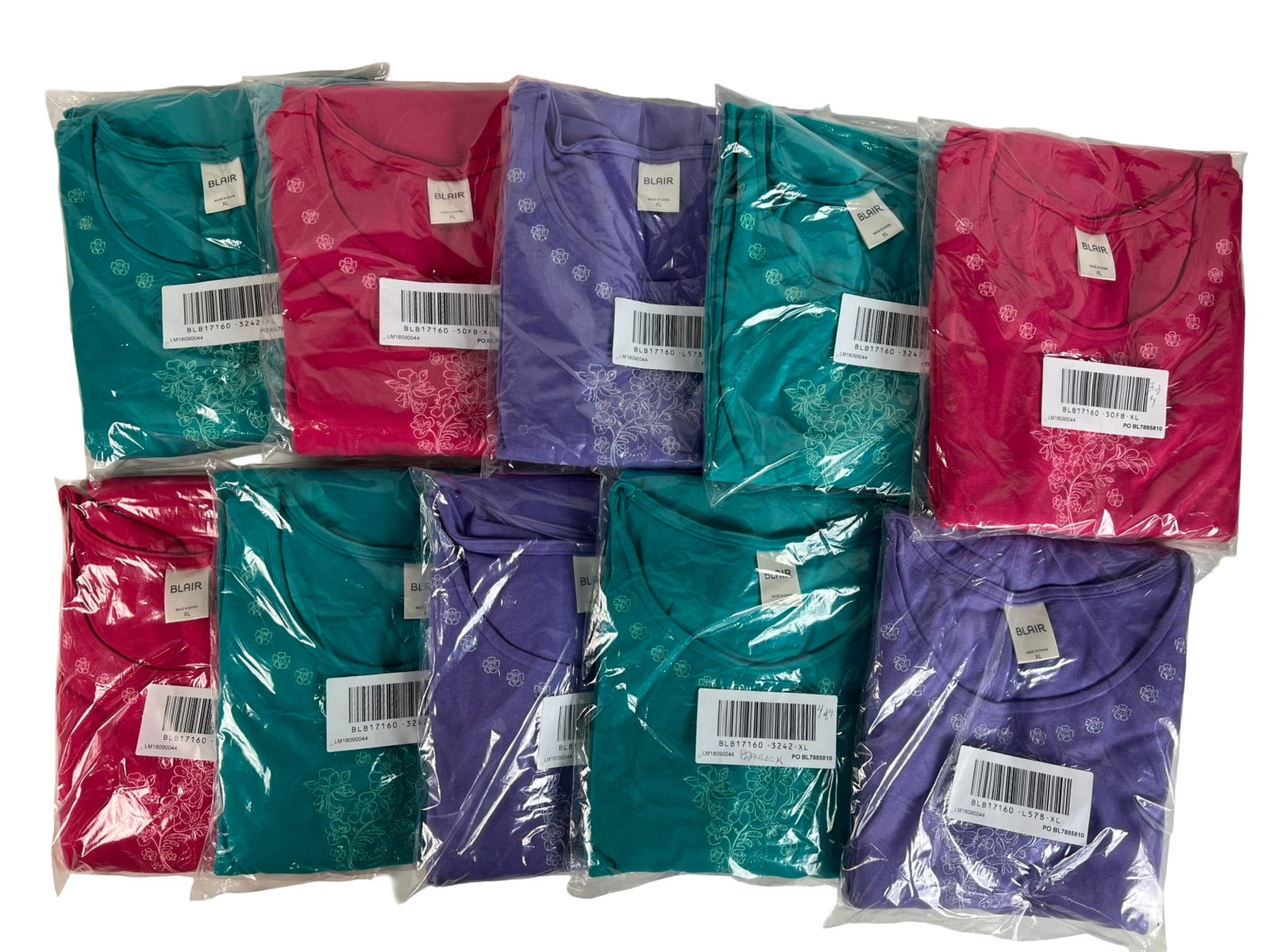 Blair Women's Embroidered Lounge Dresses: Lot of 10 Blair women's short-sleeve lounge dresses, all in size XL. Each features floral embroidery around the neckline and on the chest, along with two front patch pockets for convenience. Assorted