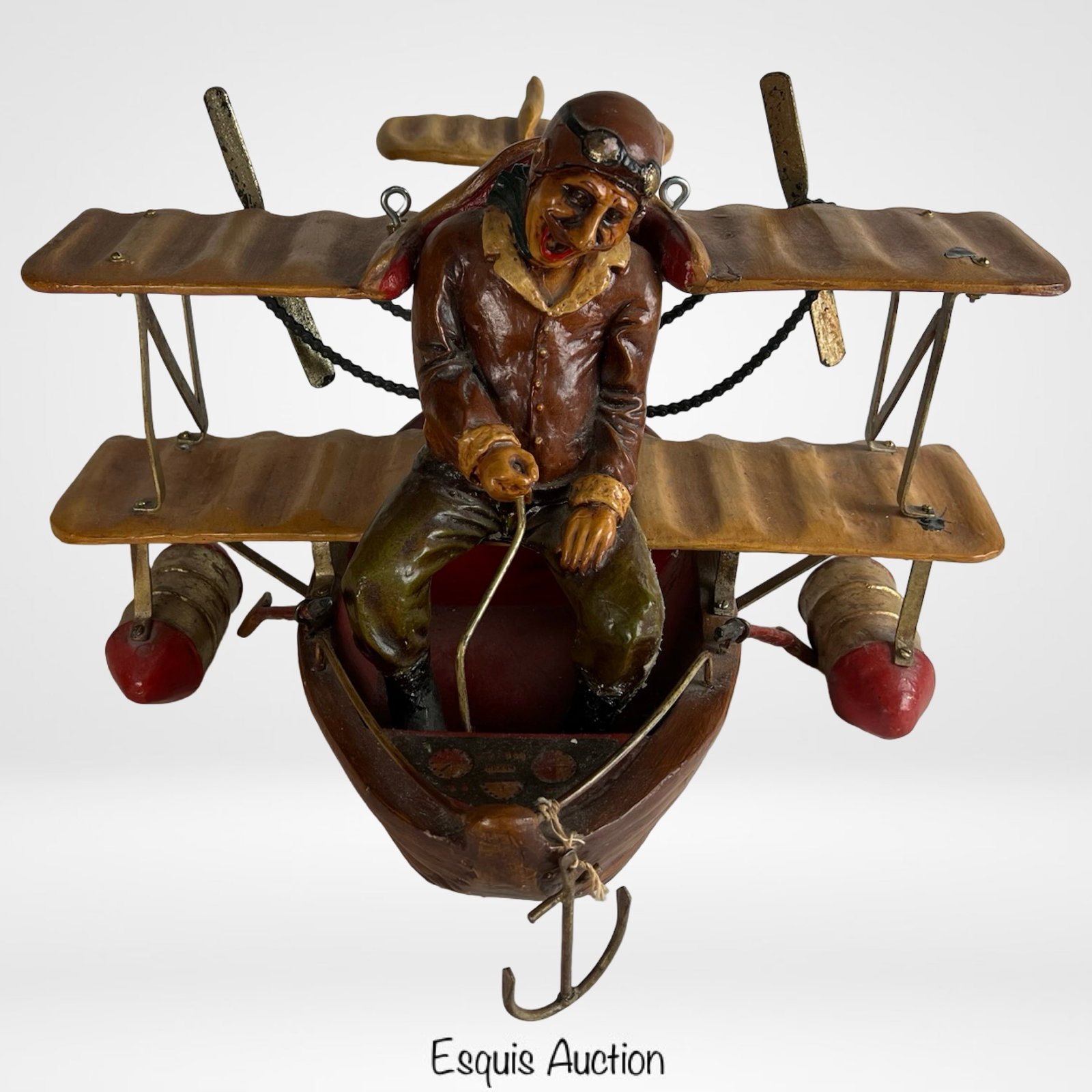 Allan Agohob Large Flying Airplane Pilot Sculpture: Whimsical large hanging sculpture by Allan Agohob, depicting a joyful aviator piloting a stylized biplane. Constructed with mixed media including painted resin, wood, and metal accents, this unique ar