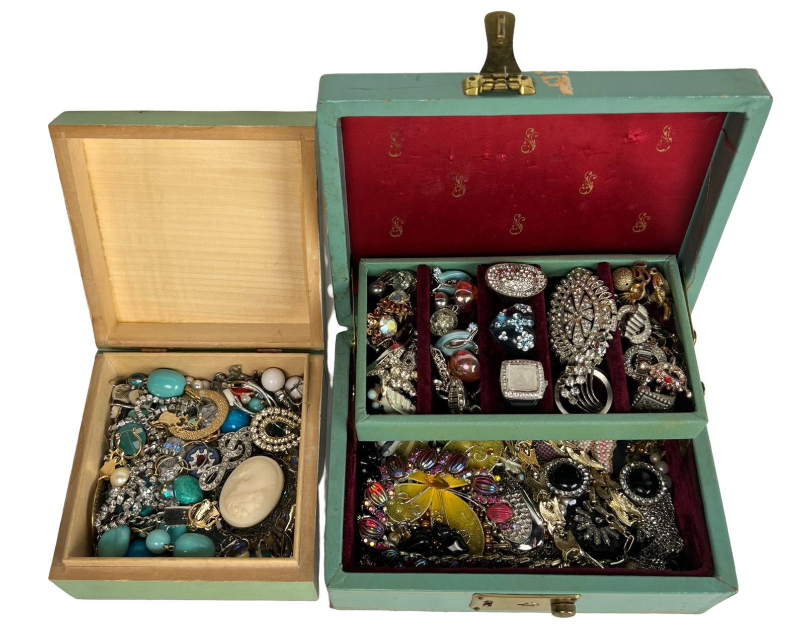 2 Boxes of Unsearched Costume Jewelry: An exciting lot of two boxes brimming with a mix of unsearched costume jewelry. This collection may include an array of necklaces, bracelets, earrings, brooches, and other accessories. Perfect for res