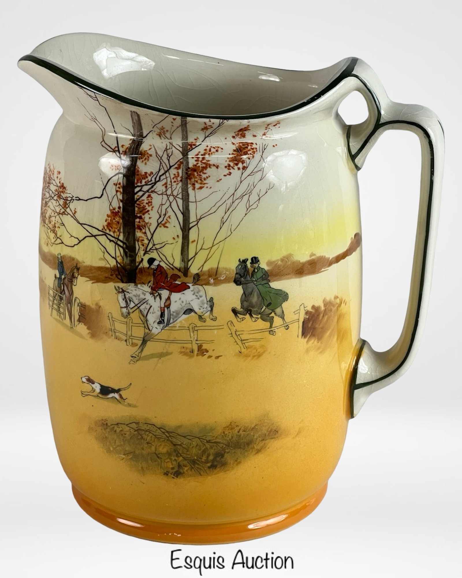 Royal Doulton "Coaching Days" Porcelain Water Jug: Antique Royal Doulton "Coaching Days" porcelain water jug, richly decorated with a classic fox hunting scene featuring riders on horseback, hounds in pursuit, and autumn countryside trees. The jug is 