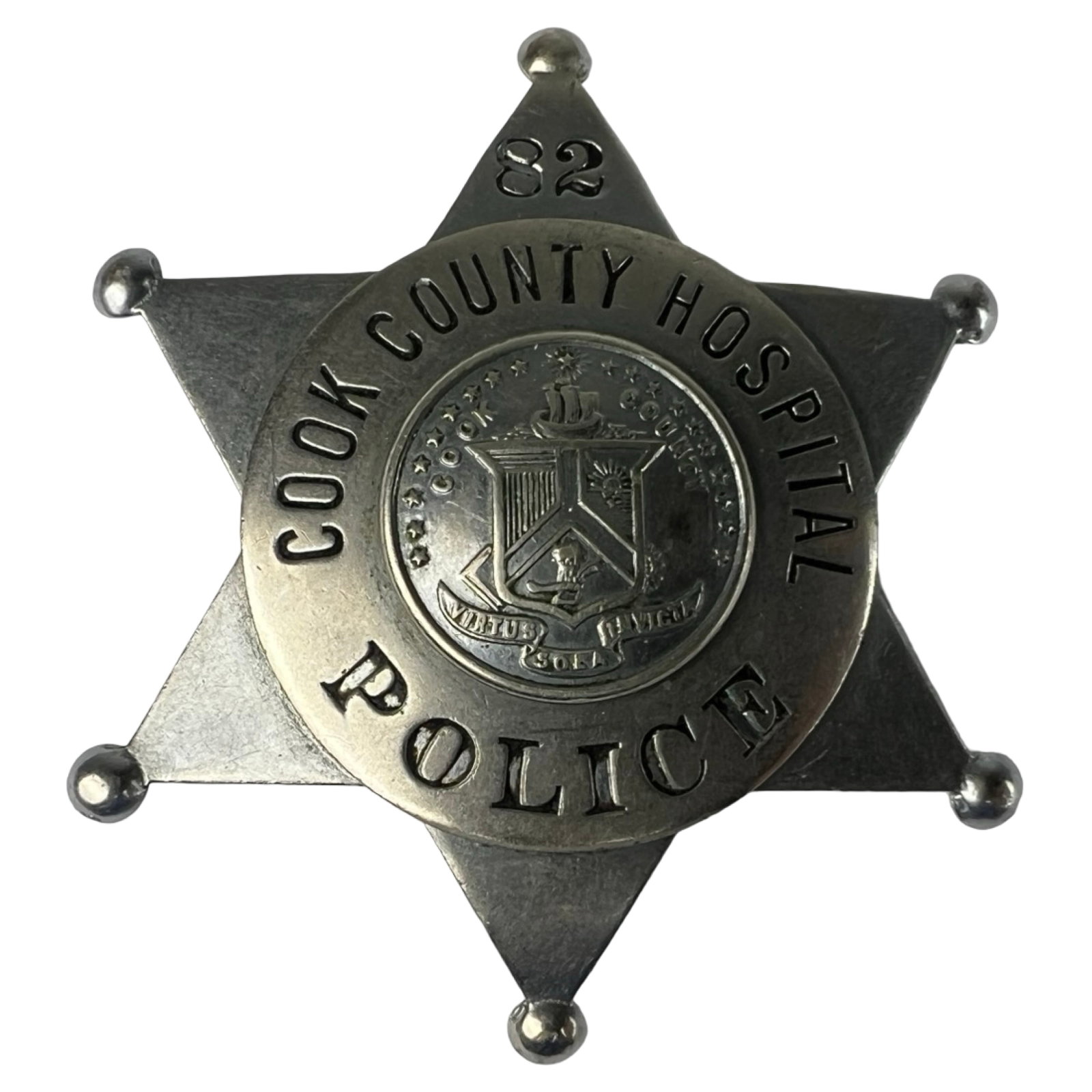 Obsolete Chicago Cook County Hospital Police Badge: Vintage six-point star badge marked Cook County Hospital Police, badge number 82, featuring the Cook County seal at center. Manufactured by Meyer & Wenthe of Chicago. Note: This is a decommissioned ba