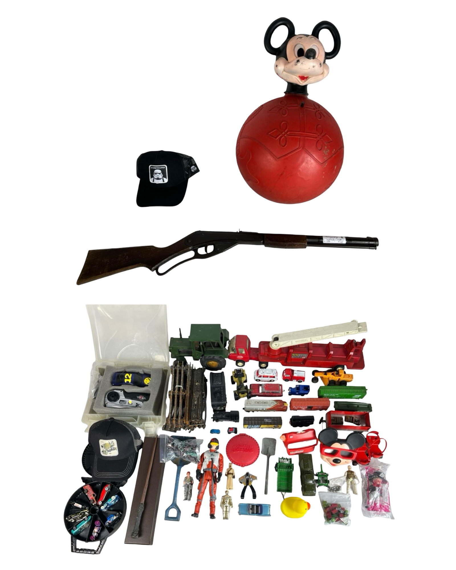 Large Lot of Vintage Toys: Mixed lot of vintage toys and collectibles, including a classic Mickey Mouse hopper ball, toy gun, die-cast vehicles, fire trucks, tractors, action figures, and assorted toy soldiers. Lot also feature