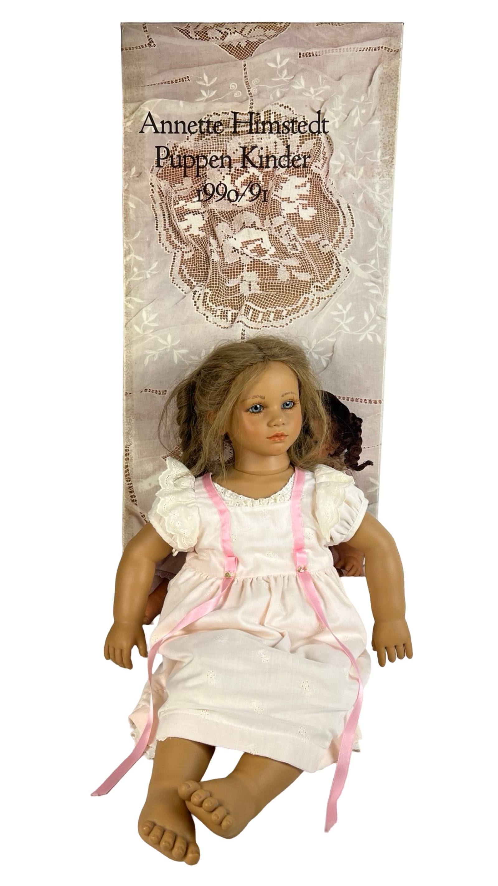 Annette Himstedt "Fiene" Barefoot Babies Doll 26": Beautifully sculpted Annette Himstedt "Fiene" doll from the Barefoot Babies collection. This 26" vinyl and cloth doll features hand-painted features, blue glass eyes, and rooted brunette hair styled i