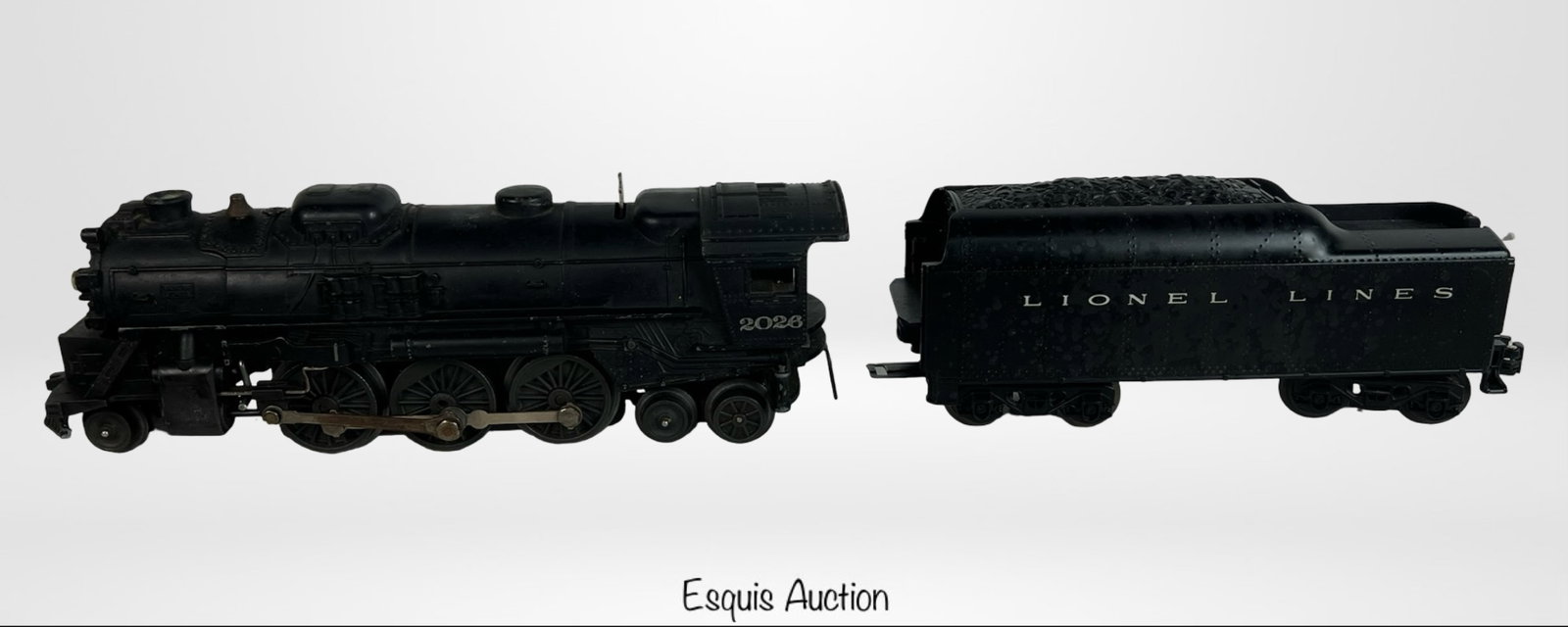 Lionel 2026 Steam Locomotive with Tender: Lionel 2026 postwar 2-6-4 steam locomotive with matching "Lionel Lines" tender.