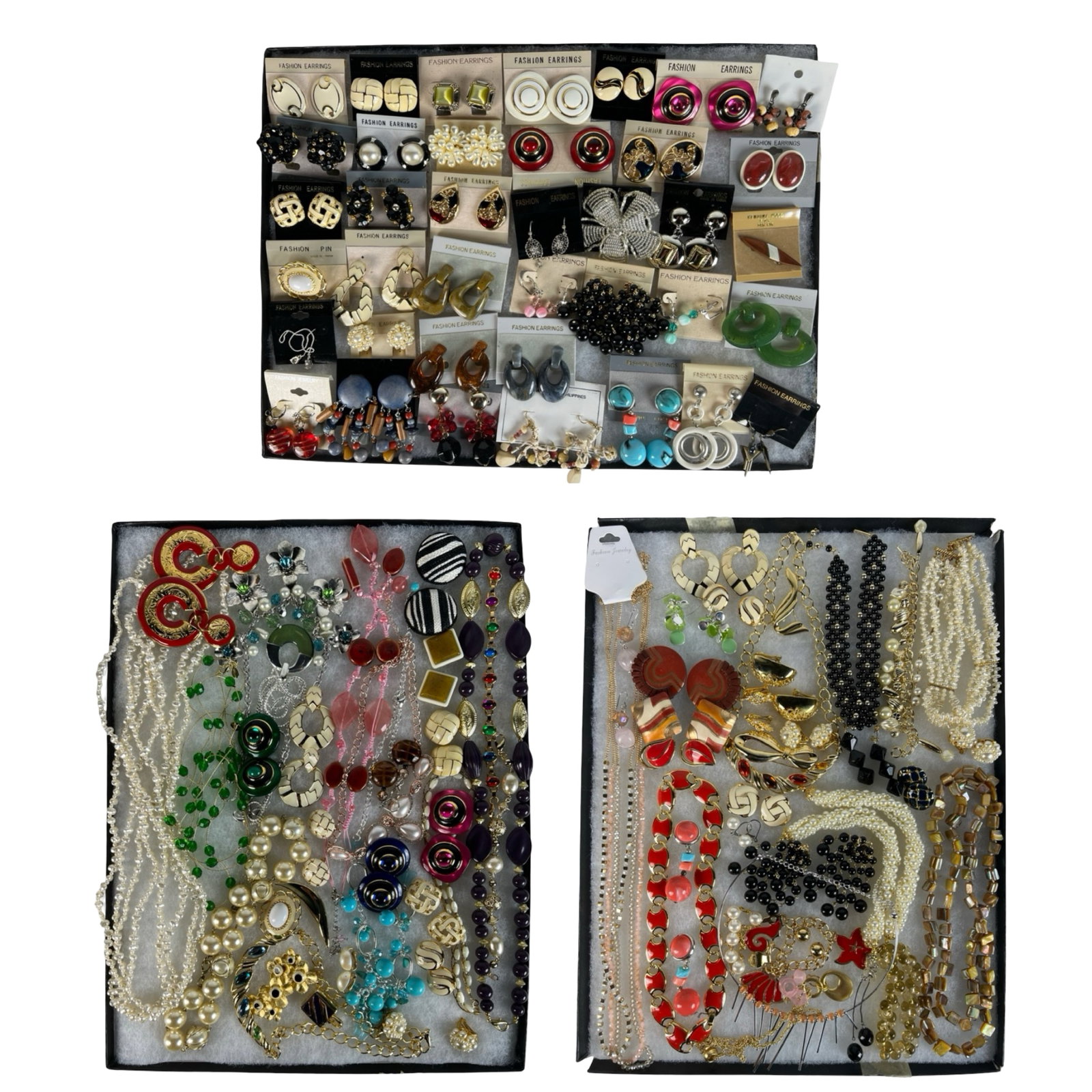 Assortment of Costume Jewelry - Sparkling Variety: Elevate your style with this dazzling Assortment of Costume Jewelry. Bursting with variety, this collection features an array of necklaces, earrings, bracelets, and more, each piece designed to add a 