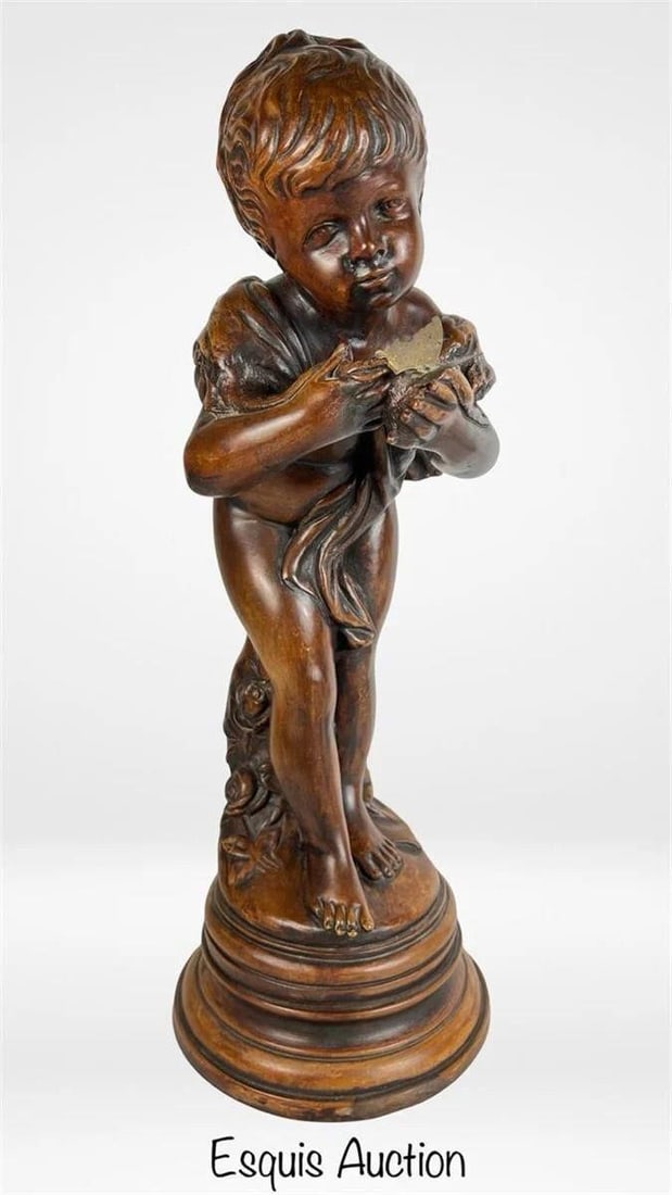 Boy with Butterfly 23" Classical Figural Statue: Charming and finely detailed figural statue depicting a young cherubic boy (putto) holding a butterfly with a gentle, curious expression. The flowing drapery and floral base add a romantic classical t