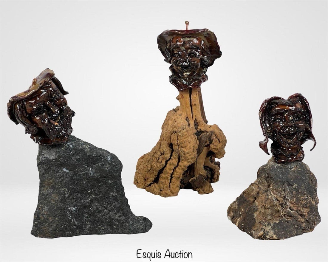 Shep Shapiro Applehead Folk Art Trio: Group of three whimsical hand-carved folk art busts by artist Shep Shapiro, featuring expressive "applehead" faces mounted on natural stone and driftwood bases. Each piece is uniquely sculpted and fin