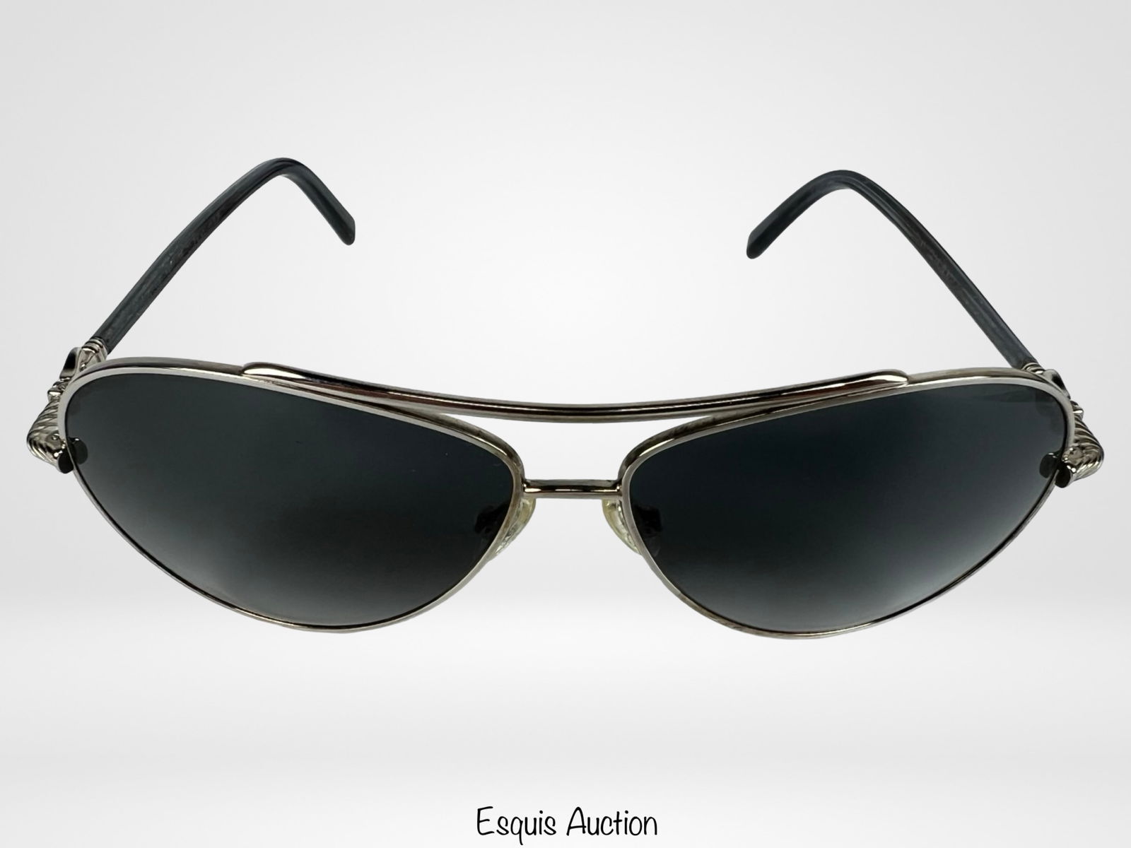 David Yurman DY007 Palladium Sunglasses: David Yurman DY007 sunglasses crafted with palladium-tone metal frames, featuring a sleek aviator design with dark lenses. The arms display Yurman's signature twisted cable detail and decorative hardw
