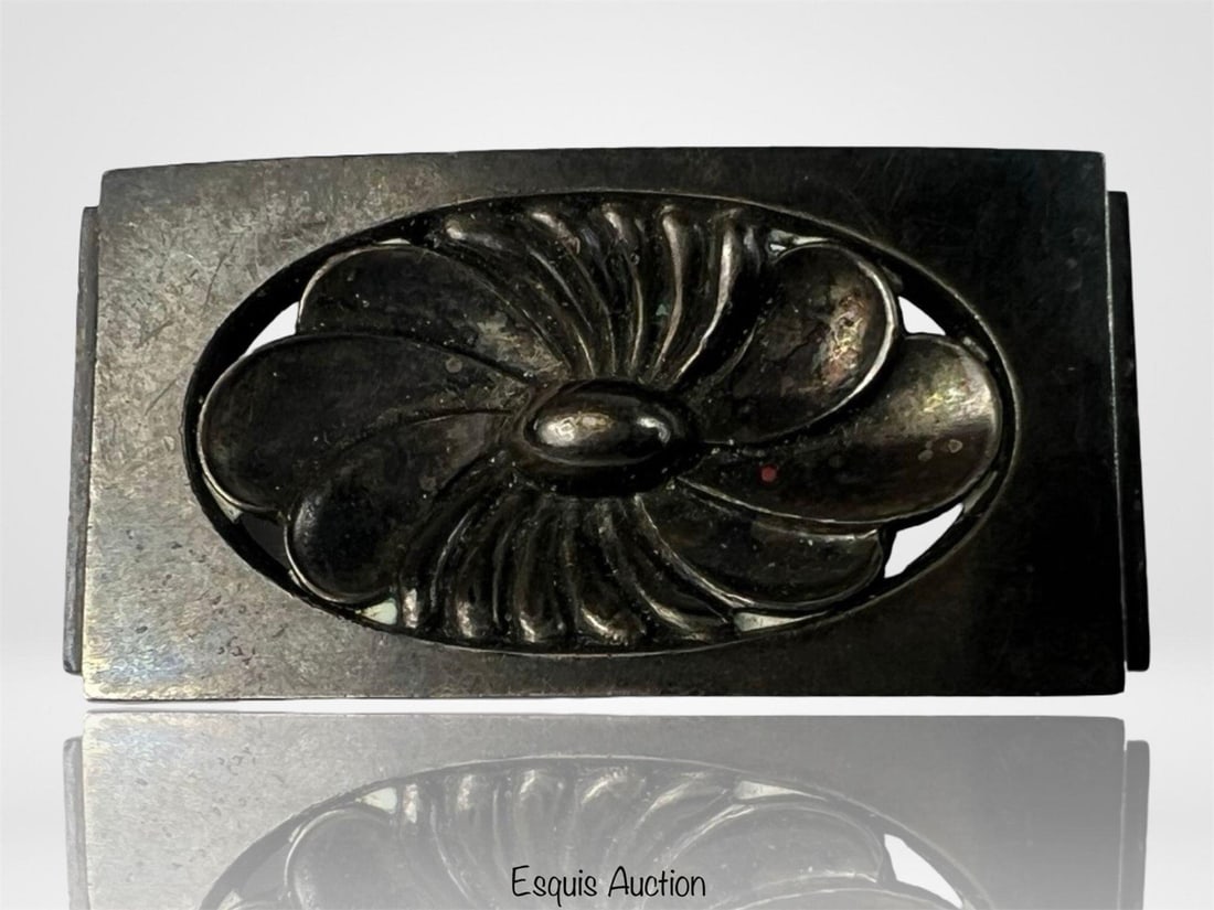 Georg Jensen Sterling Silver Brooch Lotus Blossom: Elegant vintage brooch by Georg Jensen, crafted in sterling silver and marked "Denmark." The stylized lotus flower is framed within a rectangular openwork design. Marked with Jensen's dotted hallmark,