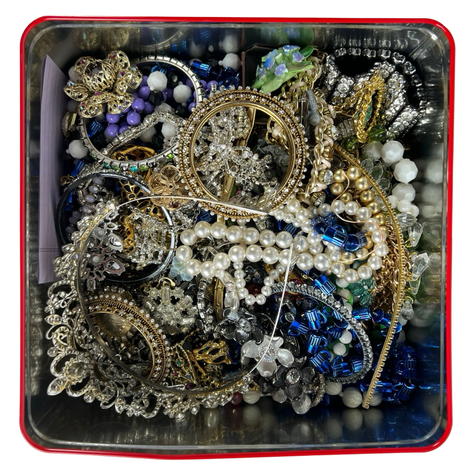 Tin Filled with Unsearched Craft Jewelry: Large tin packed with a wide assortment of unsearched vintage and modern costume jewelry, ideal for crafting, resale, or treasure hunting. The box includes bangles, beaded strands, faux pearls, brooch