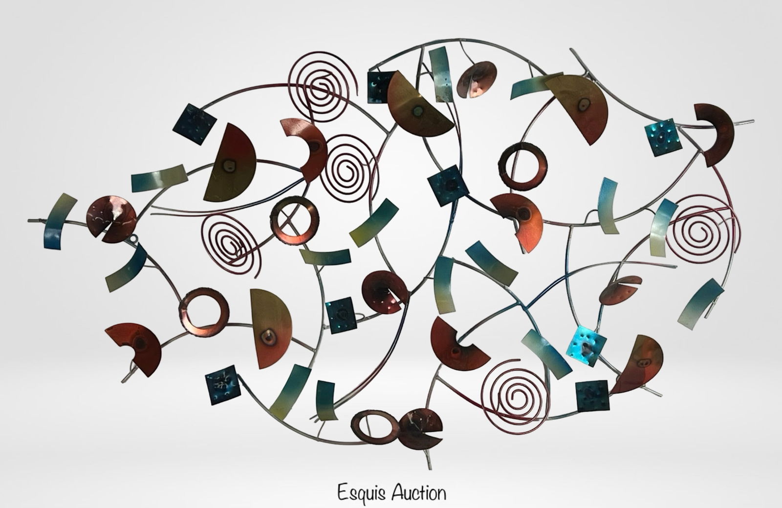 Abstract Wall Sculpture in Style of Curtis Jere: Striking mid-century modern inspired wall art sculpture composed of curved rods, spirals, discs, and geometric elements in bold shades of red, blue, and green. Evoking the dynamic energy of Curtis Jer
