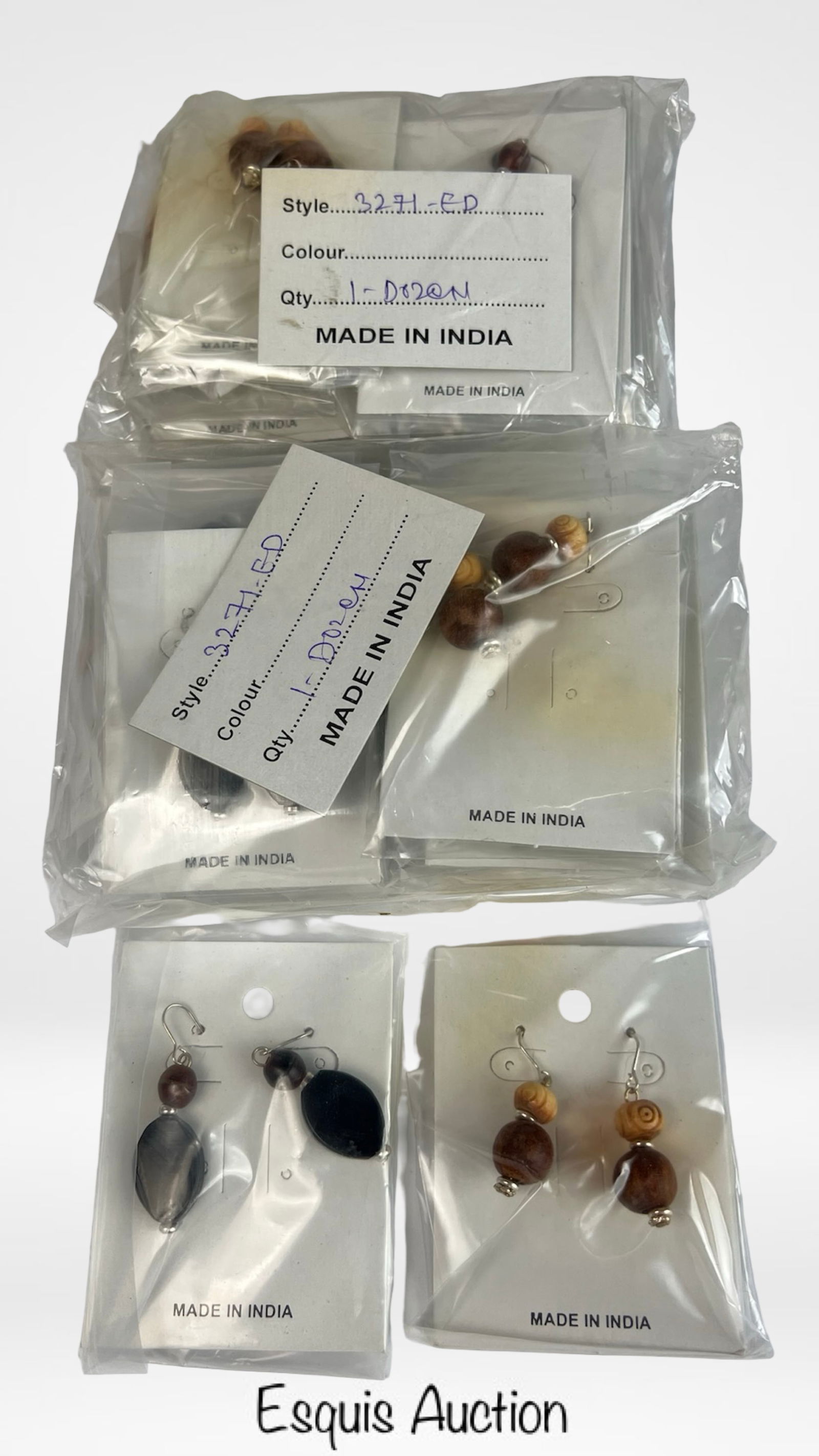 24 Pairs Handcrafted Beaded Earrings: Attractive lot of two dozen pairs of handcrafted beaded dangle earrings, featuring a mix of natural wood and polished resin beads in earthy brown and black tones. Each pair is elegantly simple with si