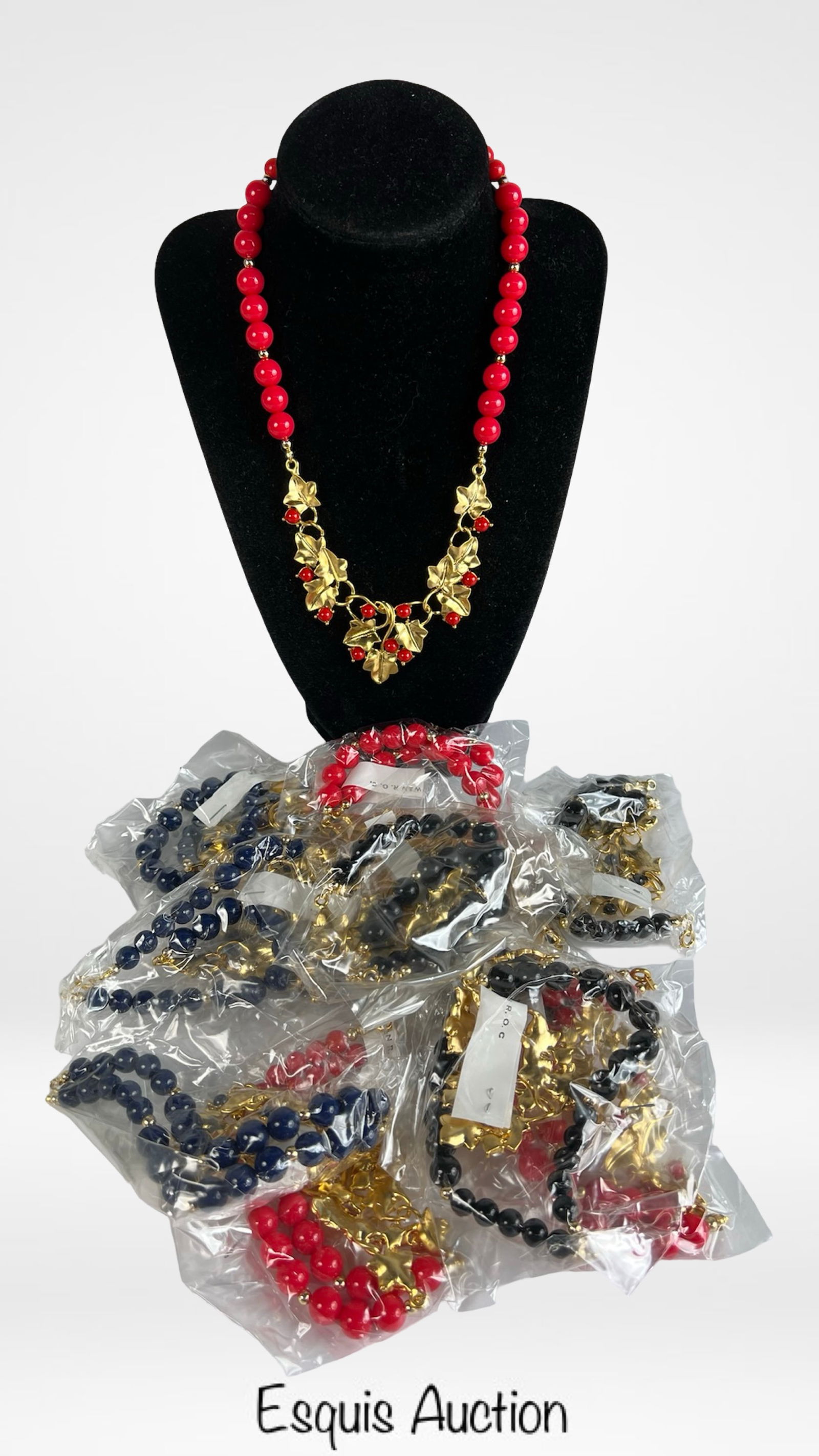 Gold-Tone Beaded Necklaces w/ Leaf and Berry Motif: Charming lot of two dozen vintage necklaces featuring glossy round beads in red, navy, and black paired with gold-tone ivy leaf accents. Each necklace combines playful color with a touch of elegance,