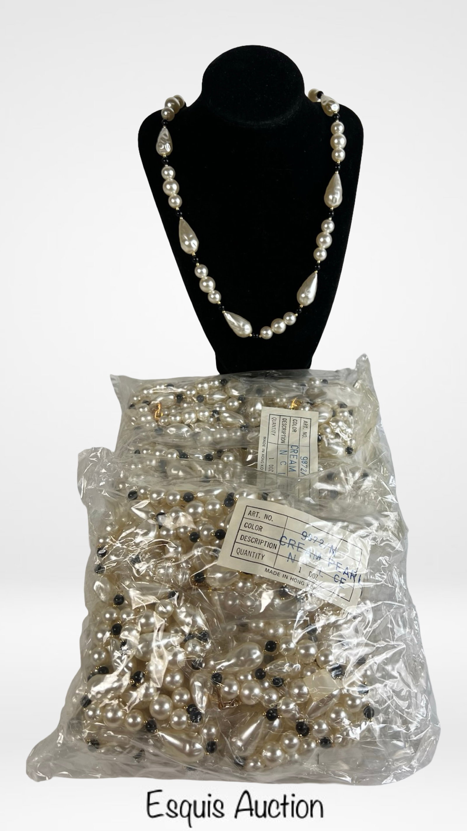 24 Faux Pearl Drop Necklaces - Cream & Black Beads: Elegant costume necklaces featuring cream-colored faux pearls and teardrop beads accented by black spacers. Each necklace offers a timeless, graduated design suitable for formal wear or vintage-inspir