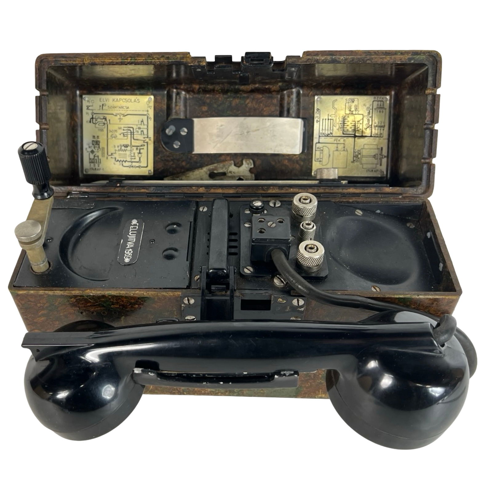 WWII Hungarian Army Military Field Telephone: WWII-era Hungarian military field telephone in rugged camouflage-patterned Bakelite casing with carry handle and rotary crank. Retains original Hungarian instruction diagrams inside the lid and emboss