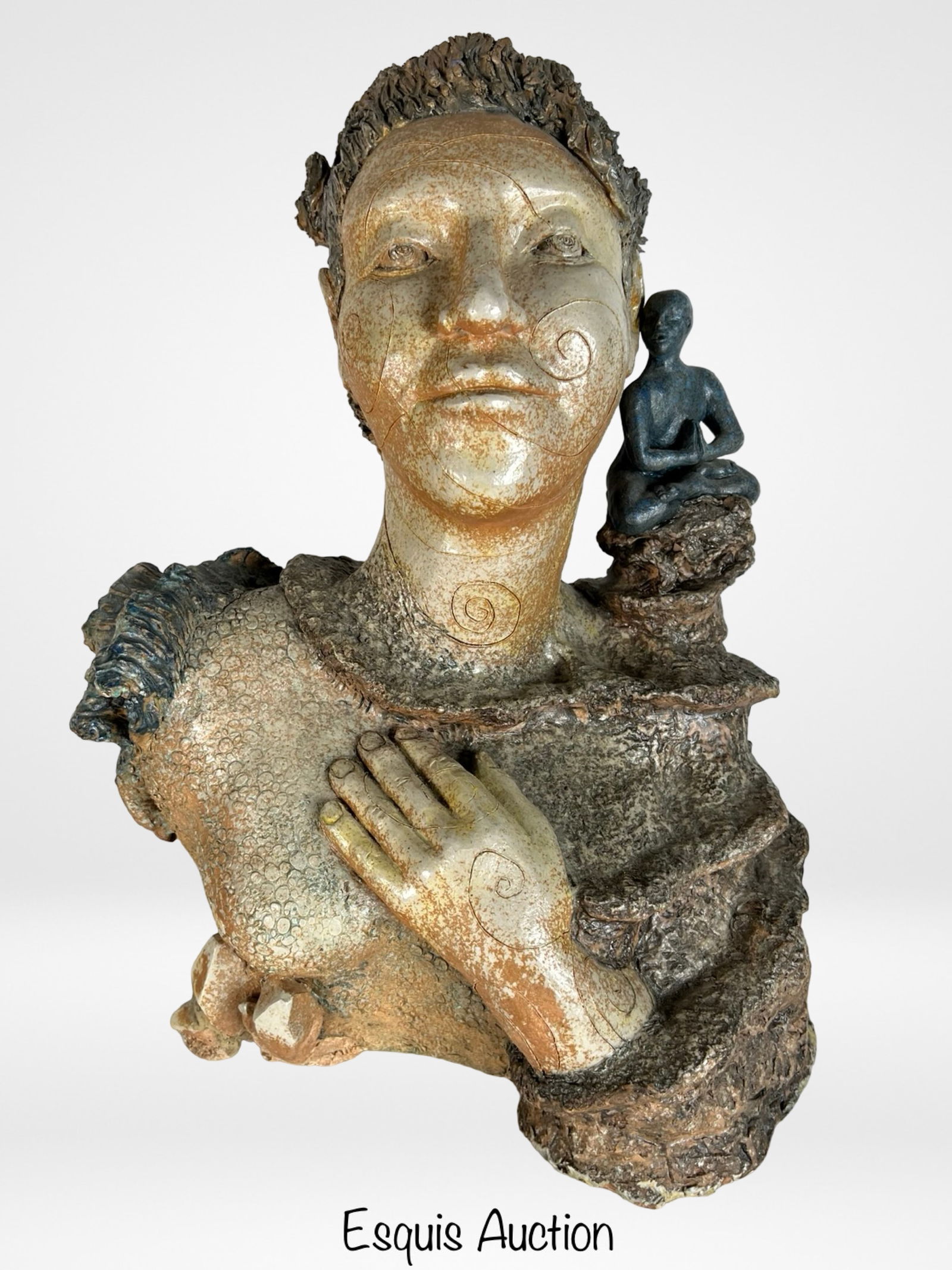 Corkie Neuhaus -Large Spiritual Ceramic Sculpture: Striking and intricately textured mixed media ceramic sculpture by Corkie Neuhaus, featuring a serene female bust integrated with a contemplative seated figure perched on the shoulder. Rich earthy ton