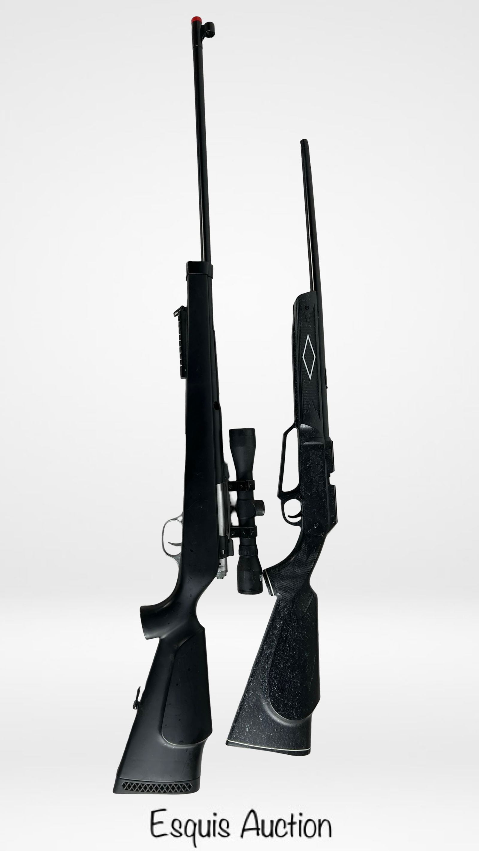 Lot of 2 Air Rifles - Daisy Powerline 880: Includes a Daisy Powerline 880 .177 caliber air rifle, capable of firing both BBs and pellets (4.5mm), featuring a molded synthetic stock and integrated rear sight. The second rifle appears to be a br