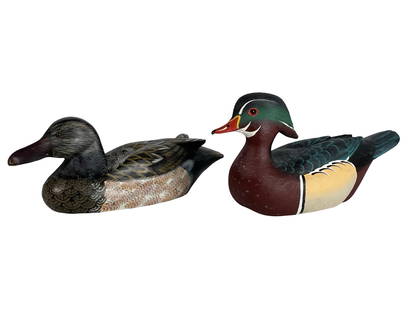 Pair of Duck Decoys - Wood Duck & Mallard: Charming pair of vintage-style hand-painted duck decoys featuring a vividly colored wood duck and a detailed mallard or mottled duck. The wood duck decoy is signed on the bottom- Jack Cox and labeled