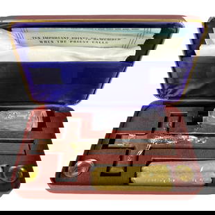 Vintage Catholic Last Rites Viaticum Set in Case: Complete Catholic Last Rites set presented in its original hard case with purple satin lining. Includes a wooden crucifix with gold-tone corpus, sealed beeswax candle, holy water bottle marked with a