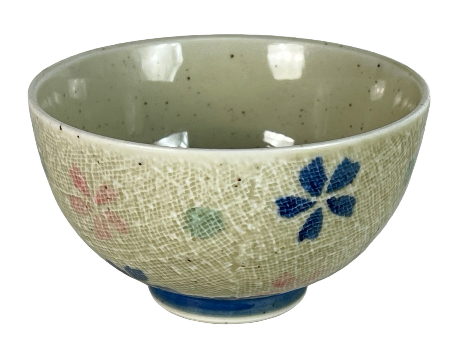 Japanese Handcrafted Crackle Glaze Bowl- "Miyuki": Charming Japanese ceramic bowl featuring an allover crackle glaze and hand-painted floral motifs in soft blue, pink, and green hues. The exterior design is delicately textured with fine crazing, givin