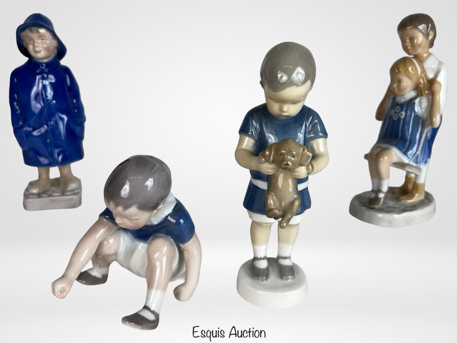 B&G Bing & Grondahl Porcelain Figurines - Children: Charming collection of Bing & Grøndahl porcelain figurines capturing tender moments of childhood, including "Ole Holds a Dog" #1747, "A Joyful Flight" limited edition #641 of 2500, "Dickie" #1636, an