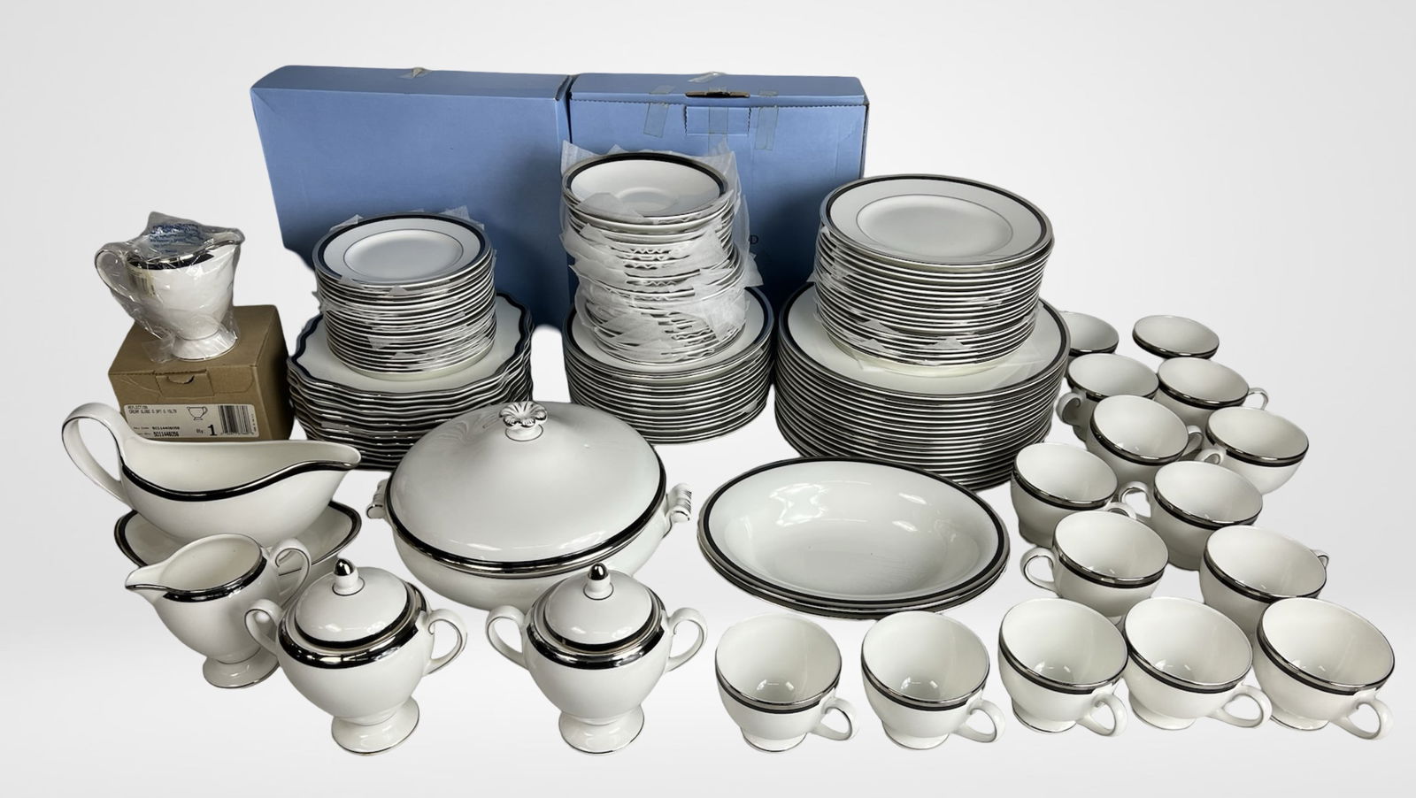 Wedgwood "Reflection" China Dinner Service for 22: Elegant and extensive Wedgwood Reflection pattern dinner set, crafted in classic white bone china with a platinum band. This large service includes 22 dinner plates, 22 salad plates, 22 dessert plates