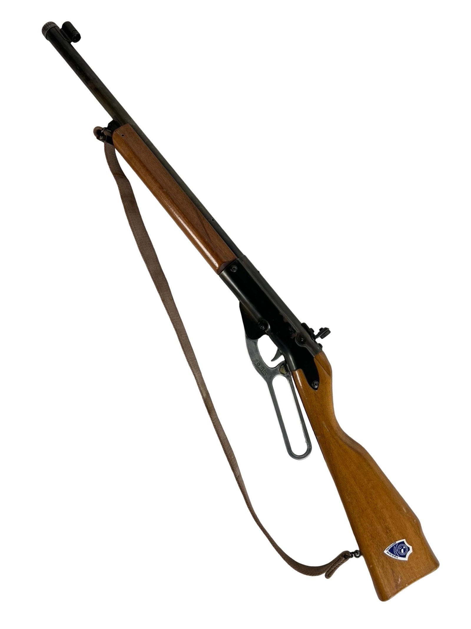 Daisy Red Ryder Lever Action BB Gun: Vintage Daisy Red Ryder BB gun featuring classic lever action, wooden stock, and forearm. In good overall condition with light wear consistent with age. The pump mechanism cocks and fires, but the gun