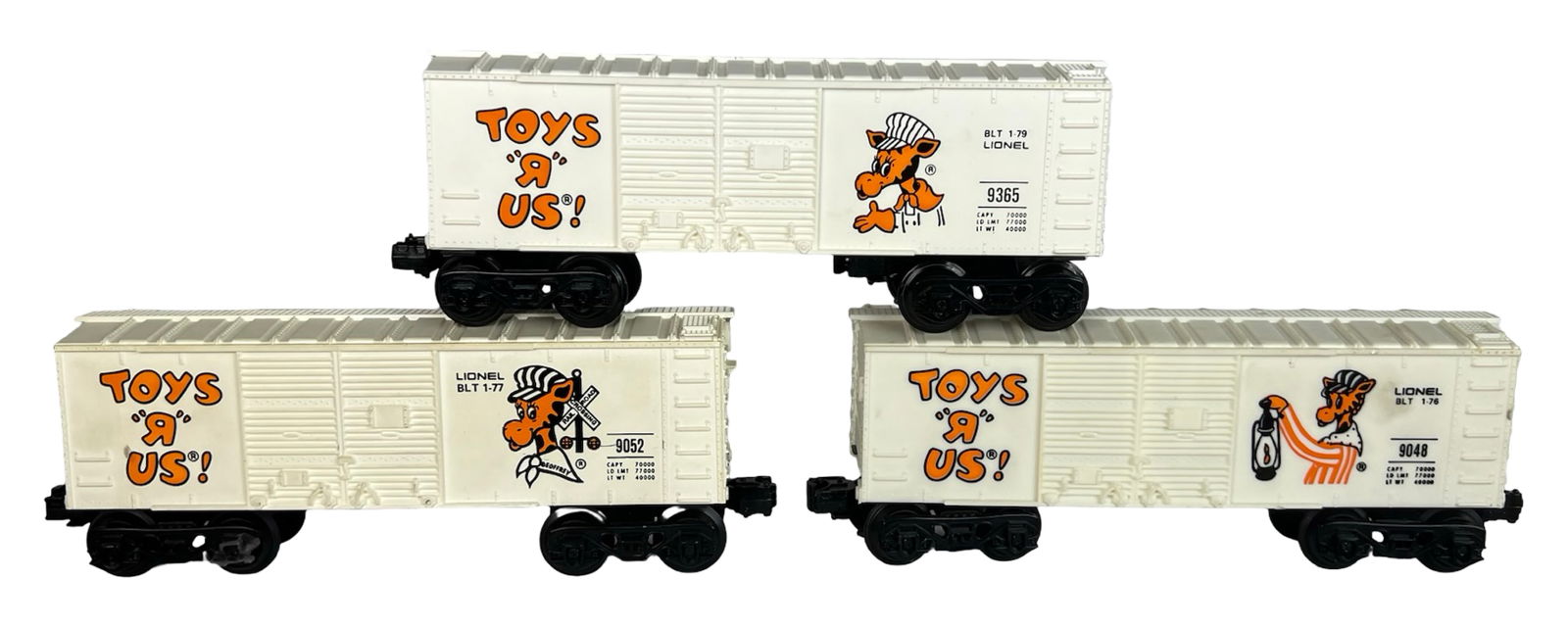 Lionel Toys "R" Us Geoffrey the Giraffe Boxcars: Set of three Lionel Toys "R" Us O-Gauge boxcars featuring Geoffrey the Giraffe graphics, including No. 9365 (BLT 1-79), No. 9052 (BLT 1-77), and No. 9048 (BLT 1-76). Each car shows bright lettering an