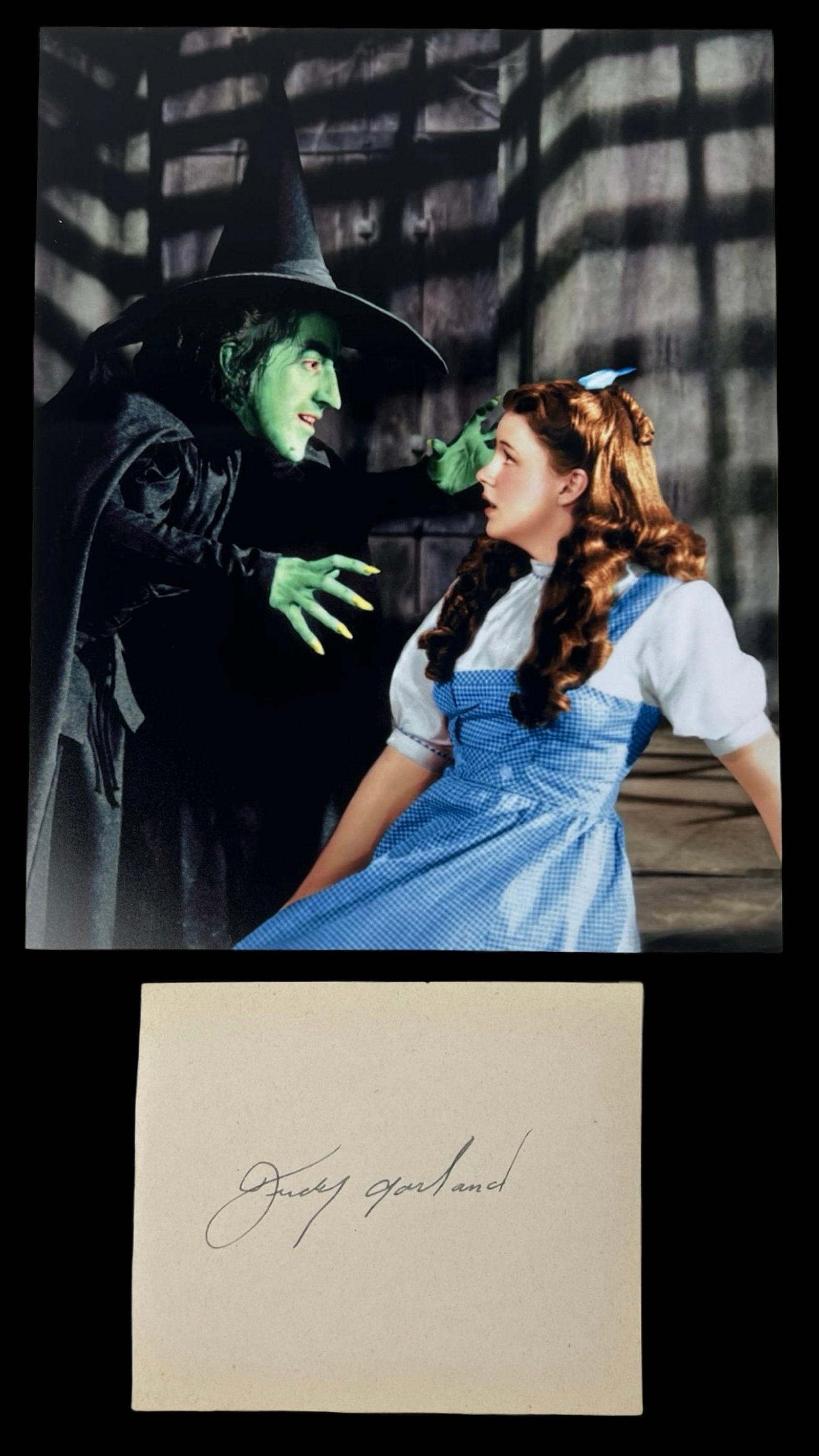 Judy Garland "The Wizard of Oz" Signed Album Page: Capture the magic of "The Wizard of Oz" with this Judy Garland Signature/ Autograph Album Page paired with an iconic photograph. The legendary Judy Garland, known for her unforgettable portrayal of Do