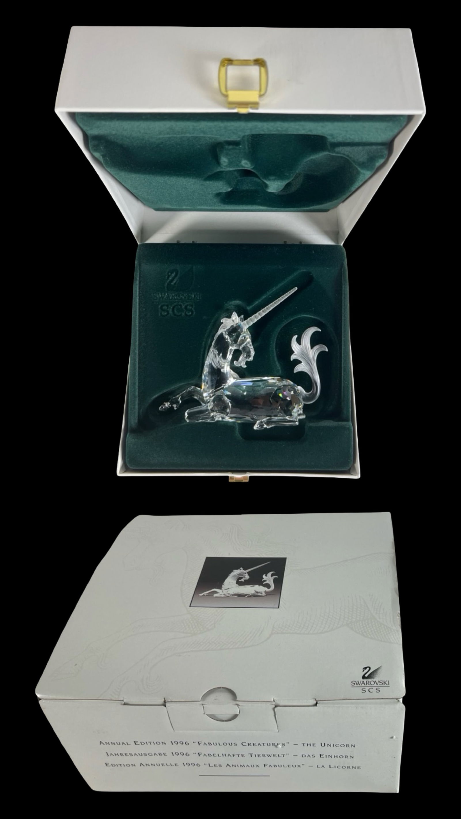 Swarovski SCS 1996 The Unicorn Crystal Figurine: Beautiful Swarovski SCS Annual Edition 1996 crystal figurine "The Unicorn" from the Fabulous Creatures series. Expertly faceted clear crystal body with frosted mane, tail, and spiraled horn, presented