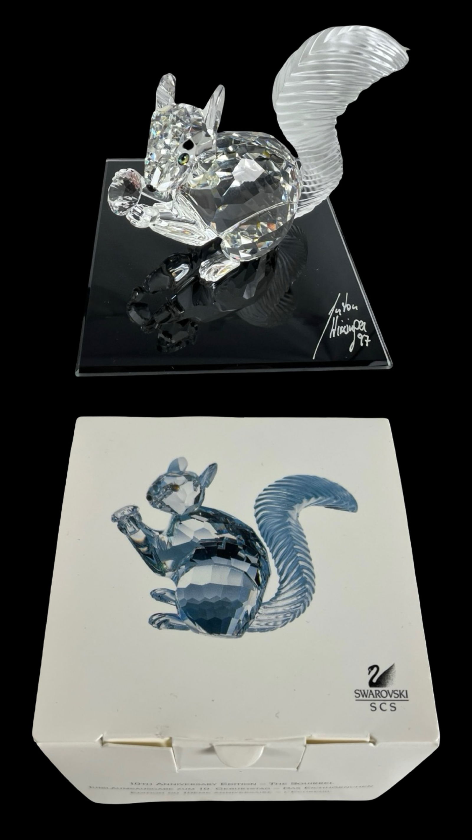 Swarovski SCS 10th Ann. Crystal Squirrel Figurine: Beautiful Swarovski SCS 10th Anniversary Edition crystal squirrel figurine, designed by renowned Swarovski artist Anton Hirzinger. This brilliant faceted squirrel is presented on a special black mirro