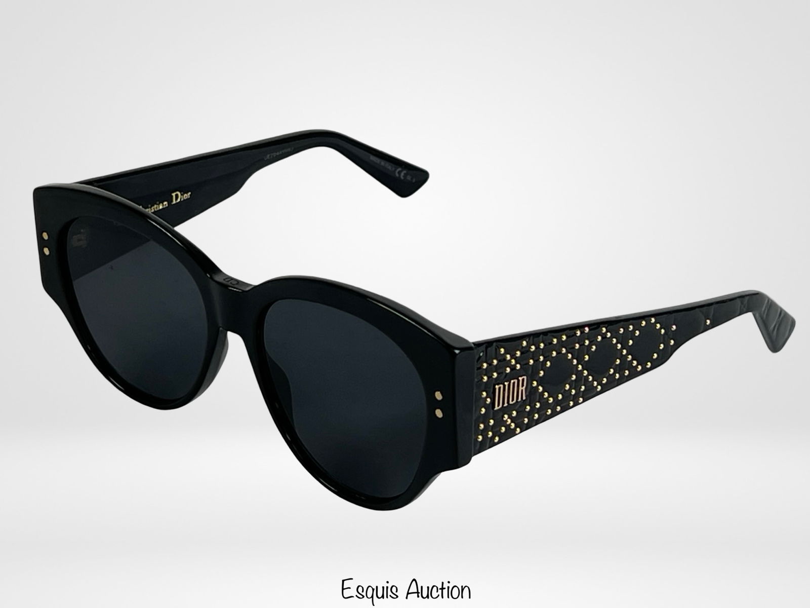 Christian Dior Studs Black Acetate Sunglasses: Chic Christian Dior sunglasses featuring the iconic "Lady Dior" studded motif in gold-tone detailing along the temples. Crafted in glossy black acetate with dark lenses. Good pre-loved condition.