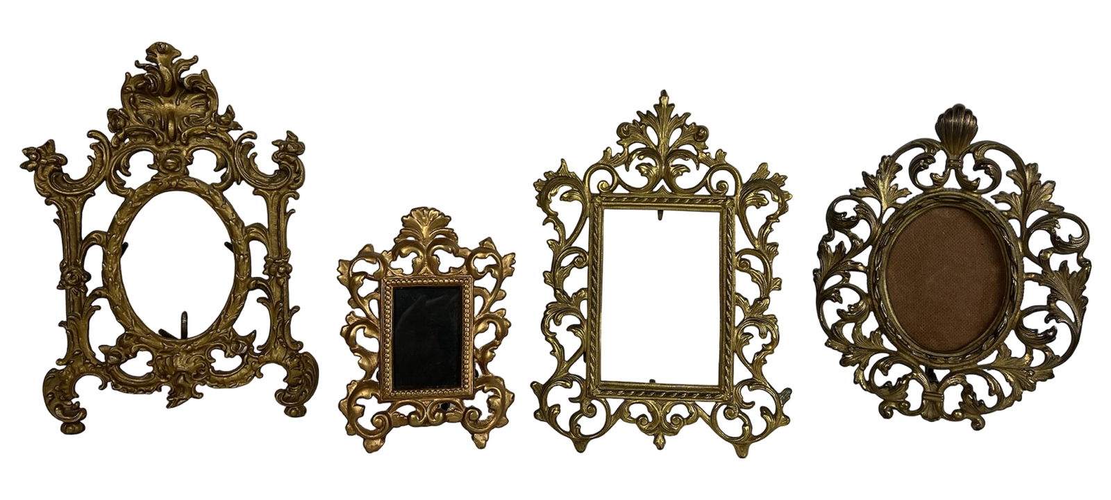 Victorian Gilt Metal Baroque-Style Picture Frames: Elegant grouping of four antique gilt metal picture frames showcasing ornate Baroque and Rococo-inspired scrollwork, florals, and classical accents. Ranging in size from 7.5"×5.5" to 13"×8.5", each