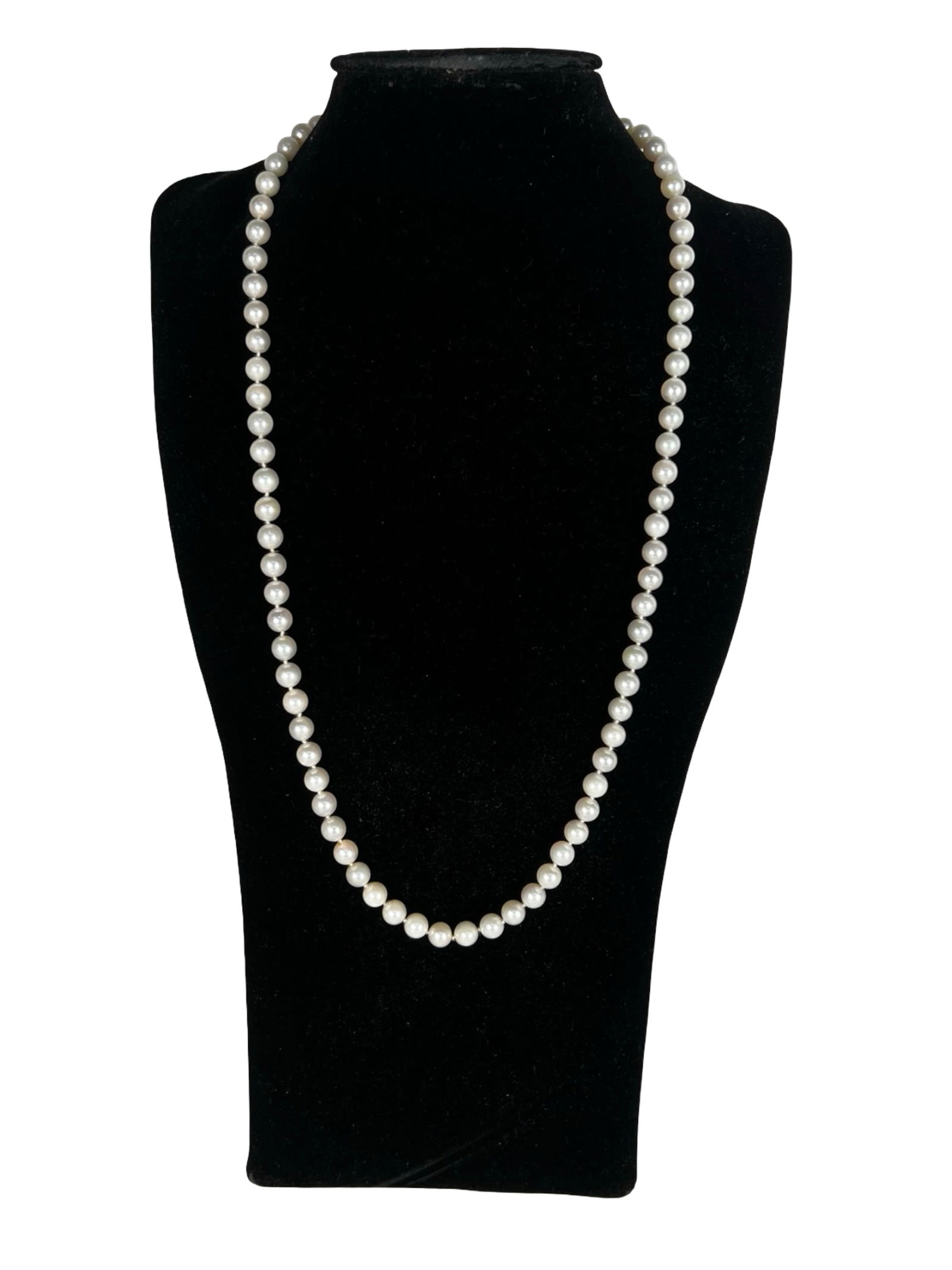 Genuine Pearl Necklace with 14k White Gold Clasp: Elegant strand of genuine round cultured pearls in soft ivory with subtle luster. Secured with an ornate fishhook clasp marked 14k white gold. Necklace measures approximately 25" long. Classic and tim
