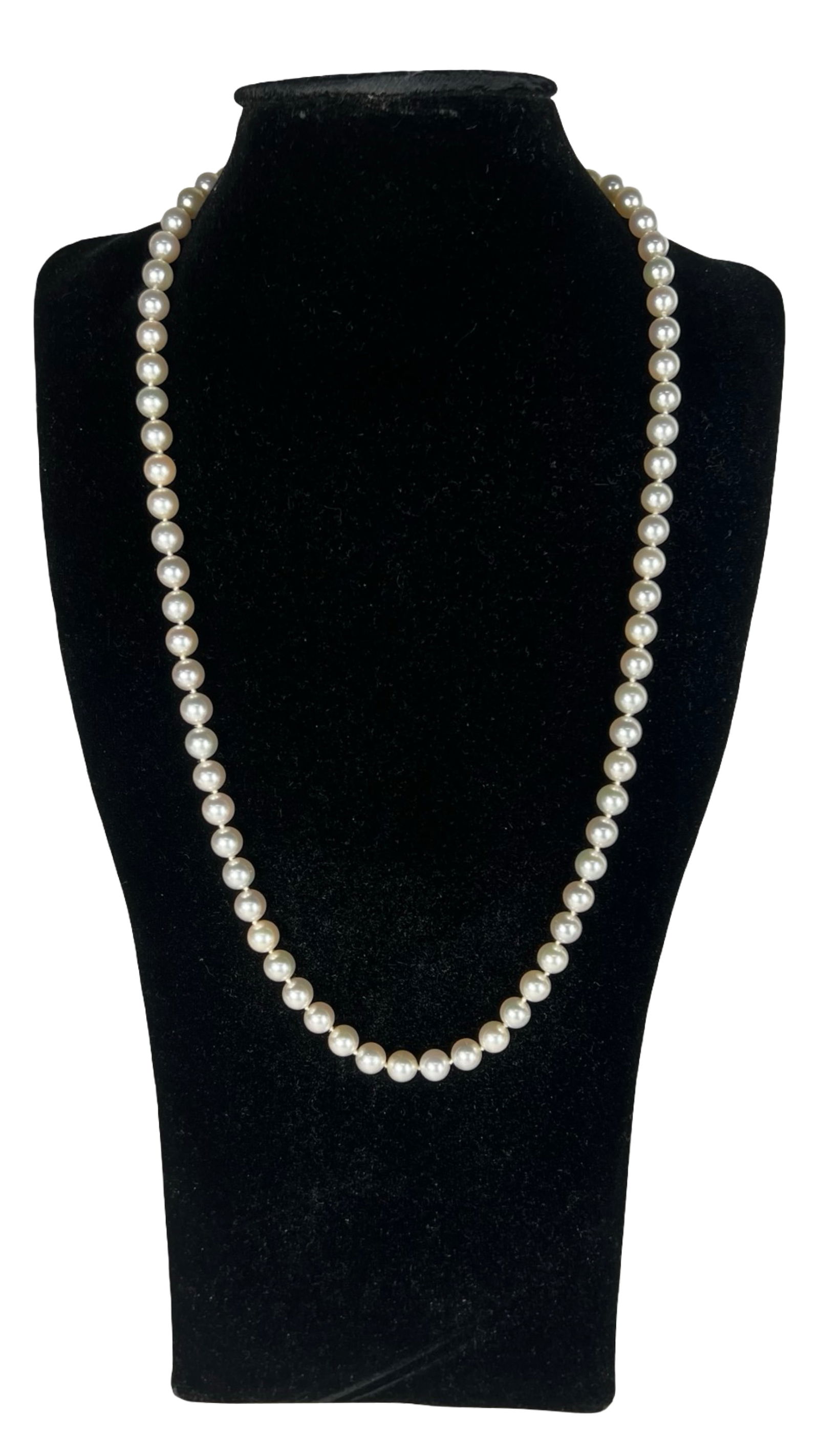 Genuine Pearl Necklace with 14K Gold Clasp: Classic strand of lustrous genuine pearls, individually knotted and finished with a finely detailed 14K gold clasp. Timeless and elegant, this 23" necklace is perfect for both formal occasions and eve