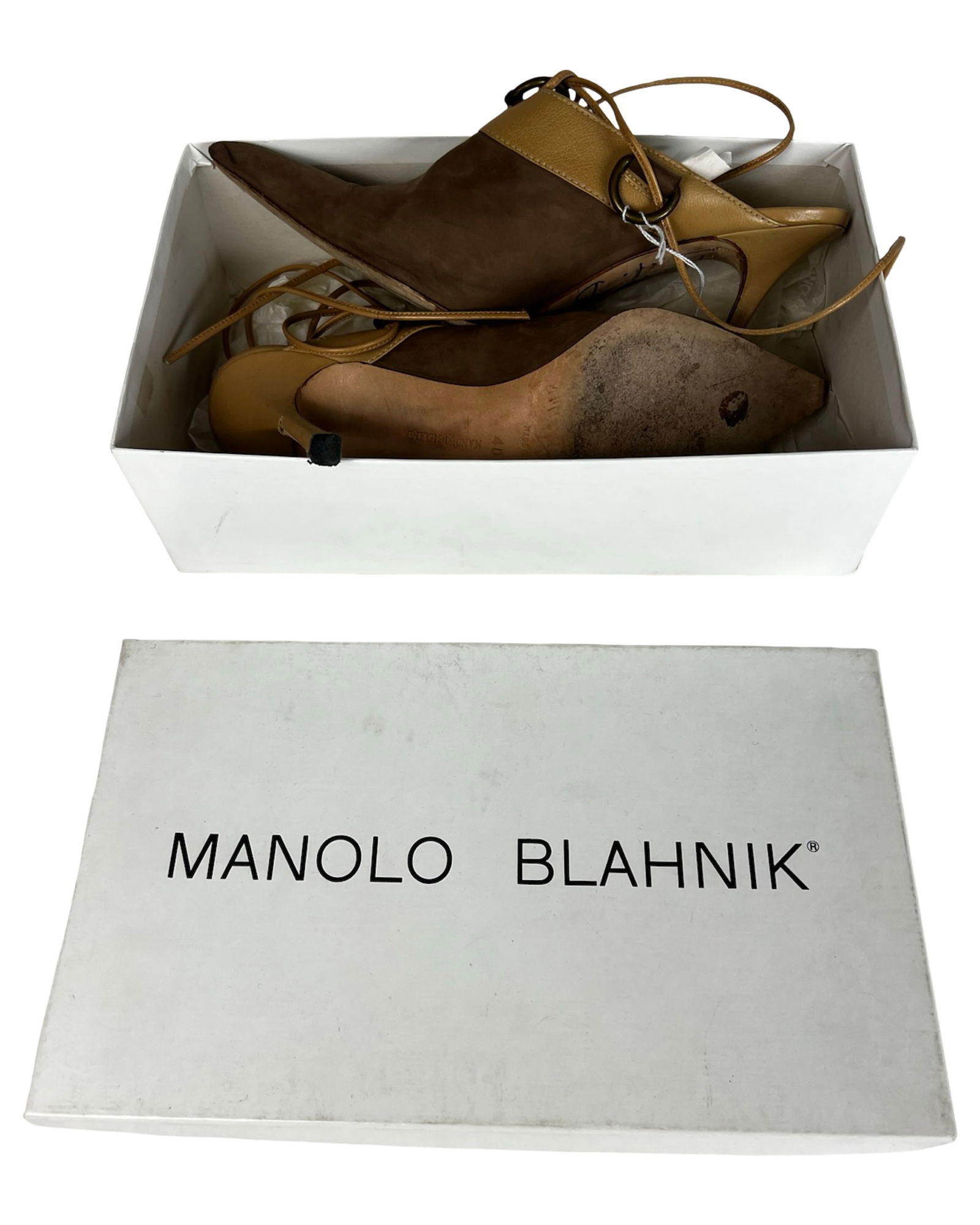 Manolo Blahnik Heels - Signed by Designer: This exceptional pair of Manolo Blahnik heels is a rare collector's item, personally signed by the legendary designer himself. The shoes are beautifully crafted in a rich combination of brown suede an