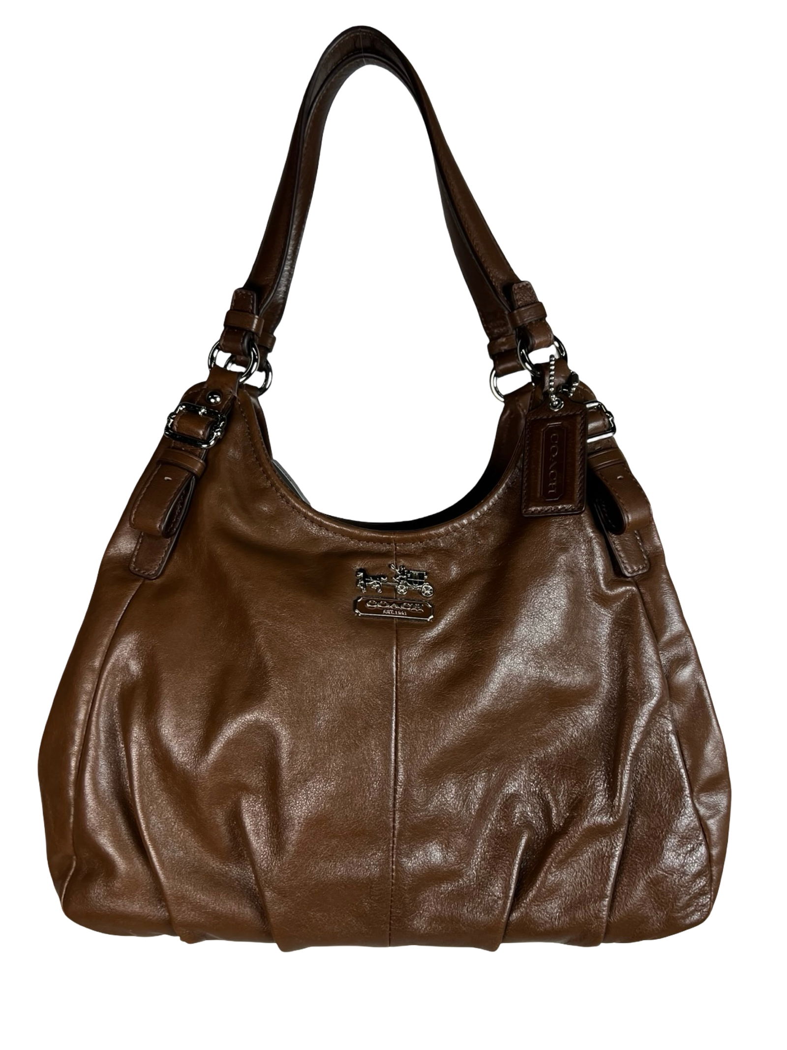 Coach Madison Maggie Brown Leather Shoulder Bag: Elegant Coach Madison Maggie shoulder bag crafted in rich brown leather with refined silver-tone hardware. This spacious and softly pleated design features dual adjustable shoulder straps, a top zip c