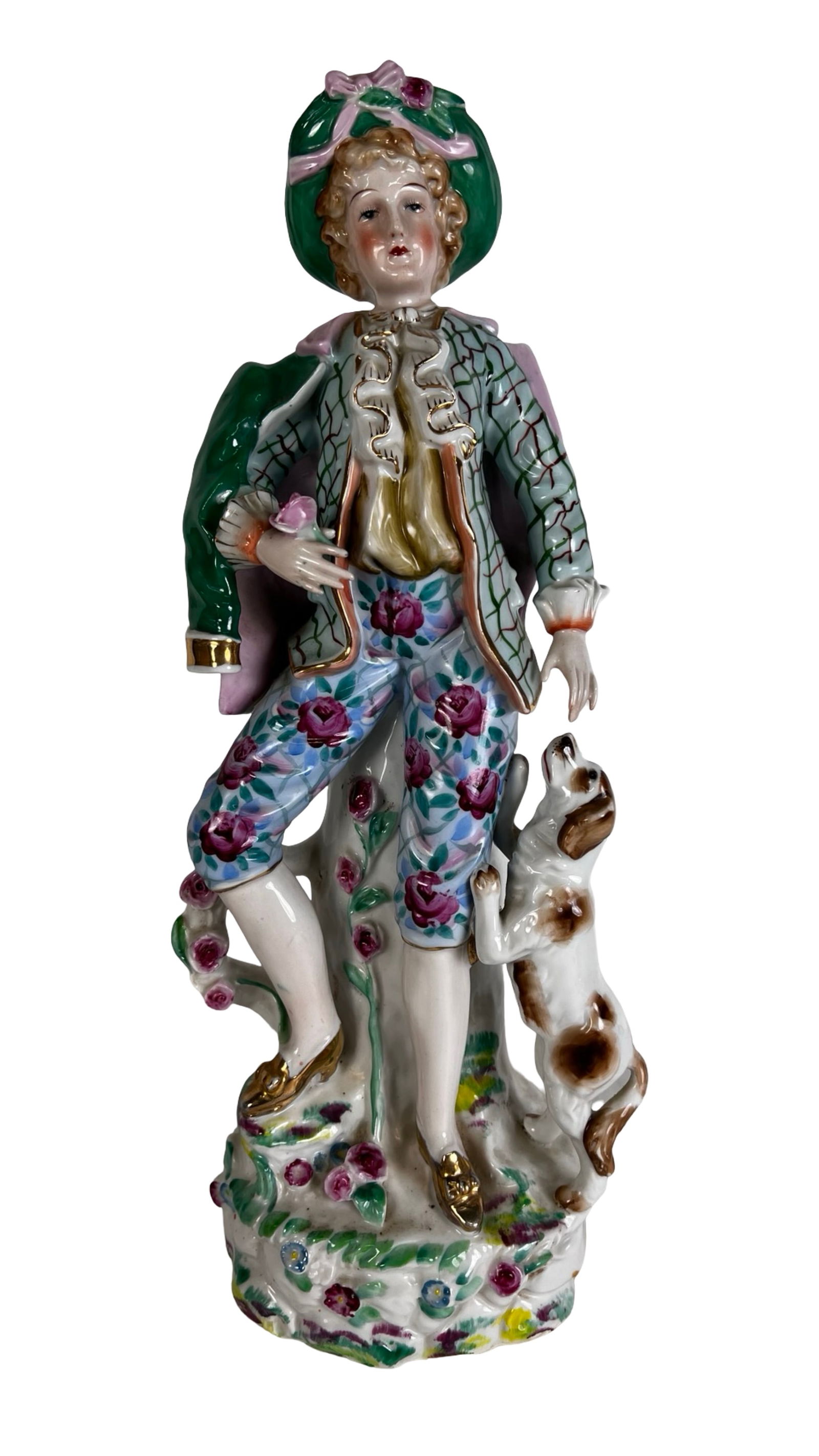 Porcelain Figurine of Rococo Gentleman with Dog: Charming hand-painted porcelain figurine depicting a young gentleman in 18th-century Rococo attire, complete with tri-corner hat, green jacket, and floral breeches. He holds a flower and stands beside