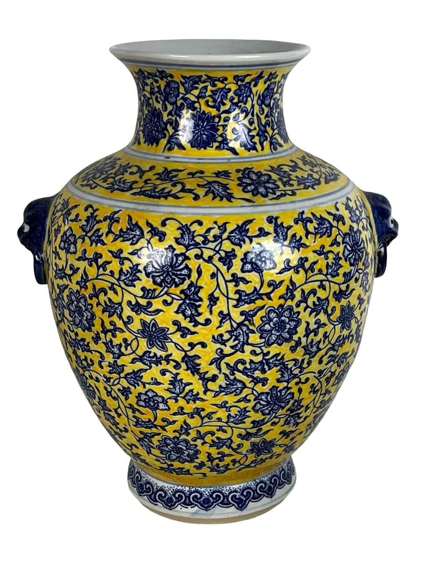 Chinese Yellow and Blue Floral Glazed Pottery Vase: Striking Chinese pottery vase with a bright yellow ground and intricate blue underglaze floral scrollwork, featuring a flared neck and stylized lion mask handles on each side. The base is decorated wi