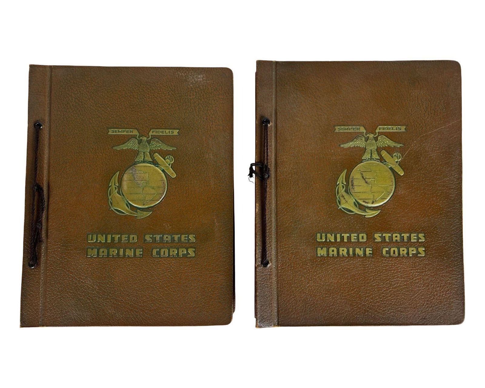 Vintage US Marine Corps Leatherette Photo Albums: This lot includes two vintage leatherette photo albums emblazoned with the United States Marine Corps emblem and the motto "Semper Fidelis." Each album features a brown textured cover with embossed an